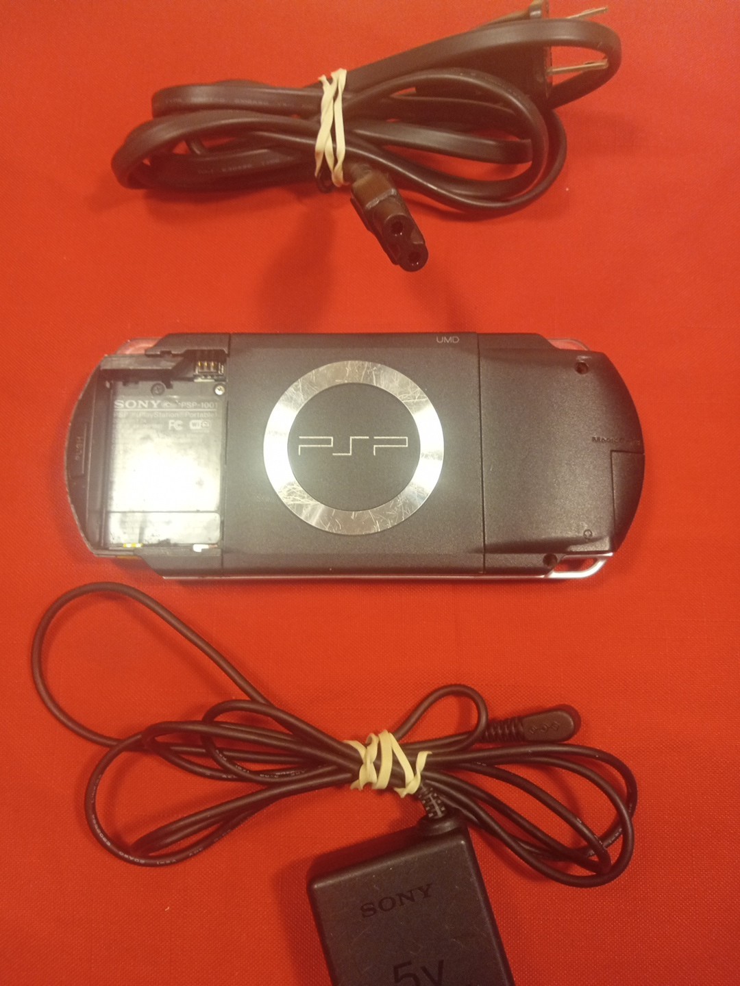 PSP 1001 CONSOLE+AC ADAPTER/NO TOGGLE BUTTON OR BATTERY & COVER/ SEE…