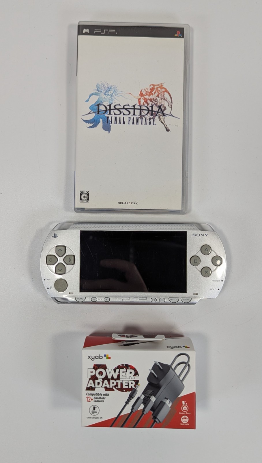 Sony PSP 1000 Silver Console Japanese w/Charger 32MB Card FF Dissidia Patopan