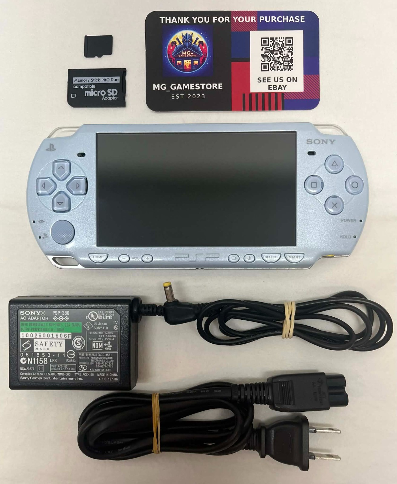 PSP2000 Felicia Blue / New Battery / Genuine Sony Charger / Region Free / 16 GB