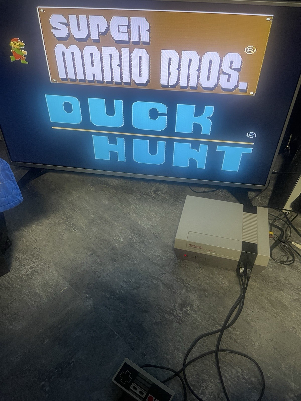 Original Nintendo NES bundle with cords, 2 controllers, zapper, and 17 games