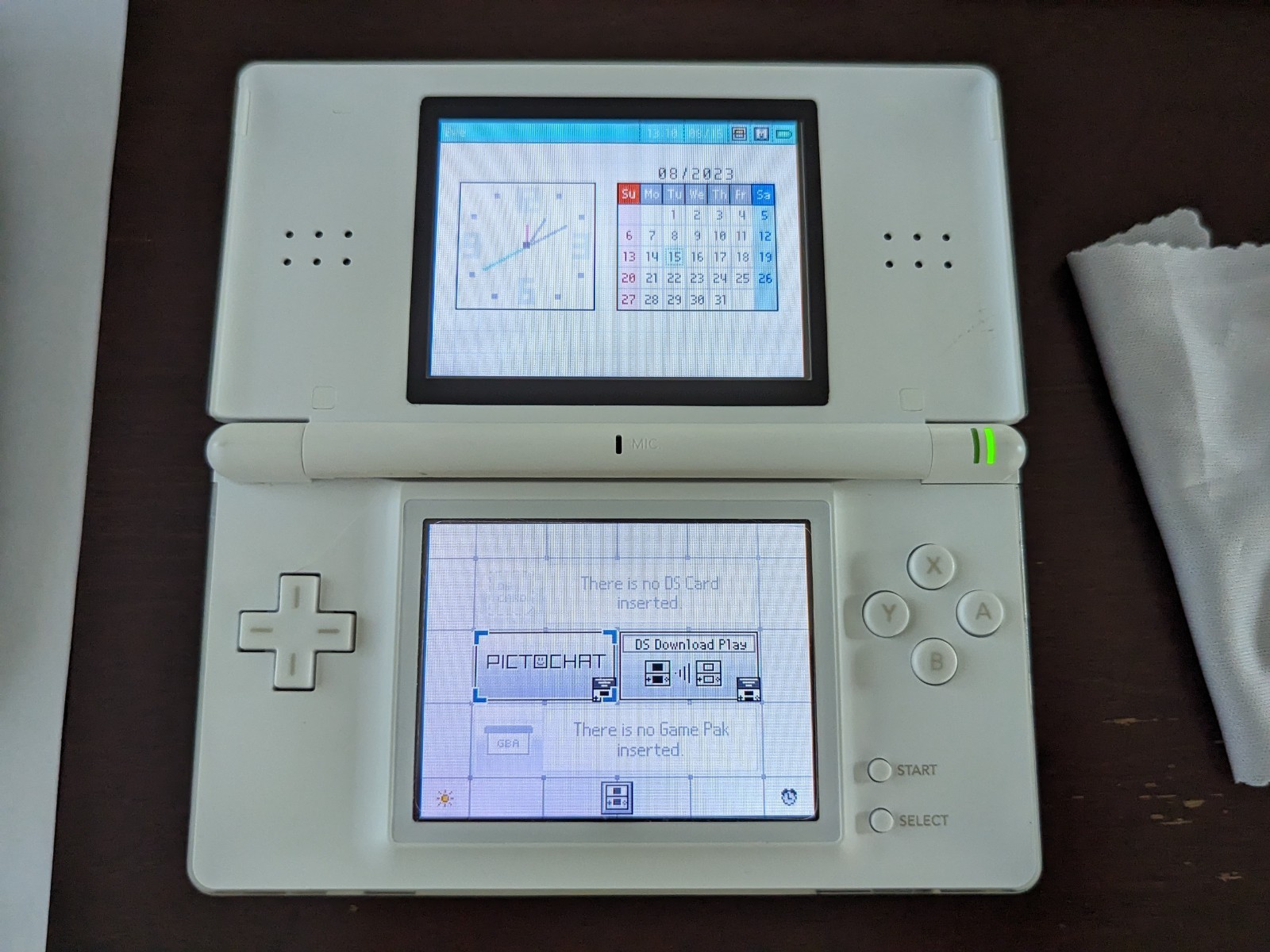Nintendo DS Lite with Charger, Hard Case, soft case, 15 games in cases.