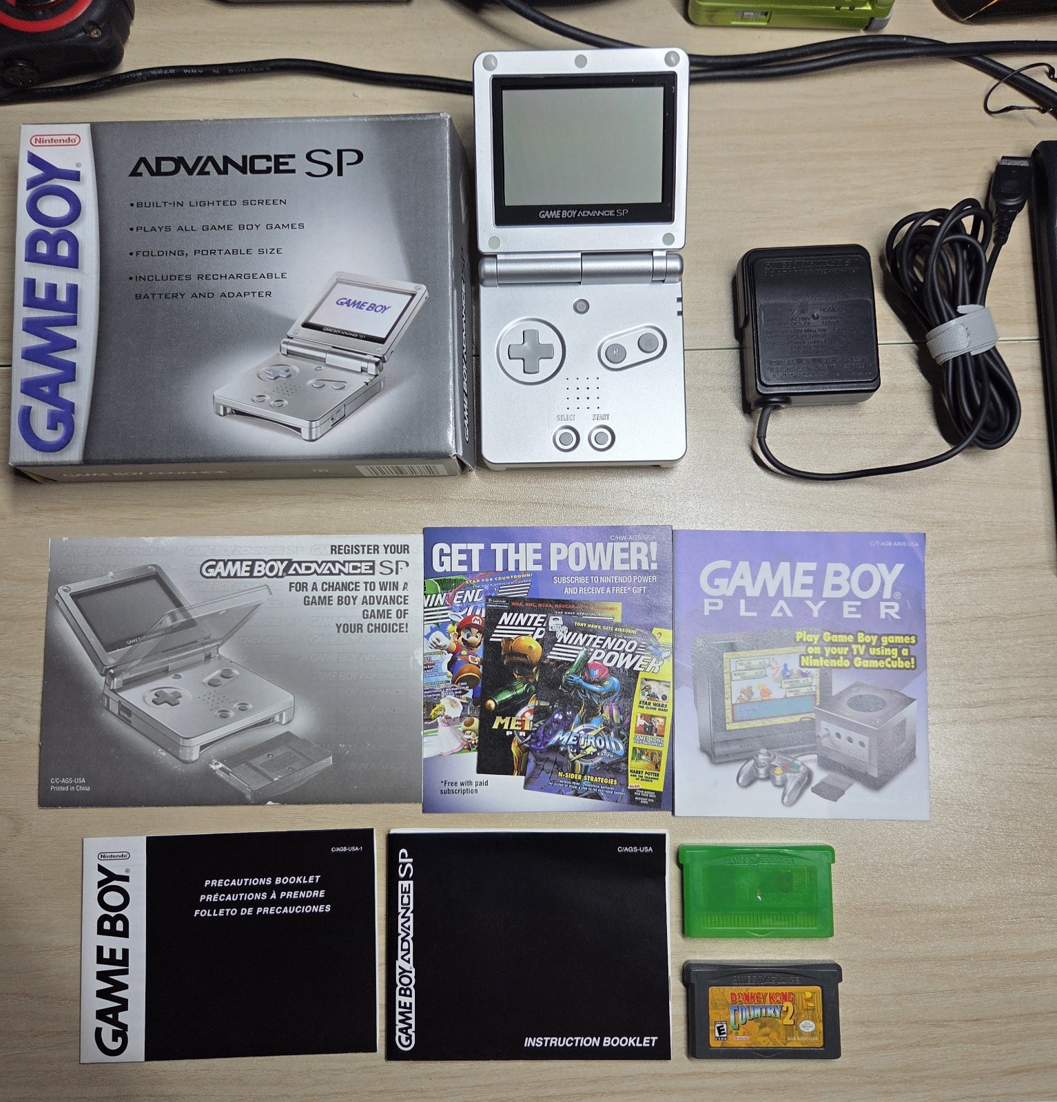 Platinum Nintendo Game Boy Advance SP (AGS-001) CIB with Pokémon Leaf Green