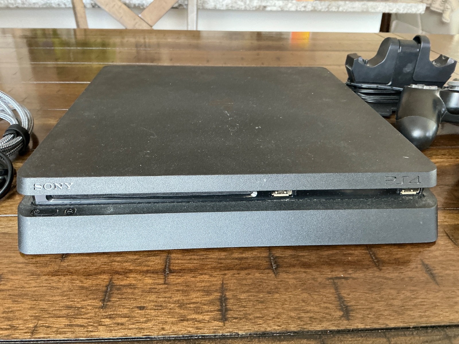 Sony PlayStation 4 Slim Console, two Controllers, Controller Dock and cables