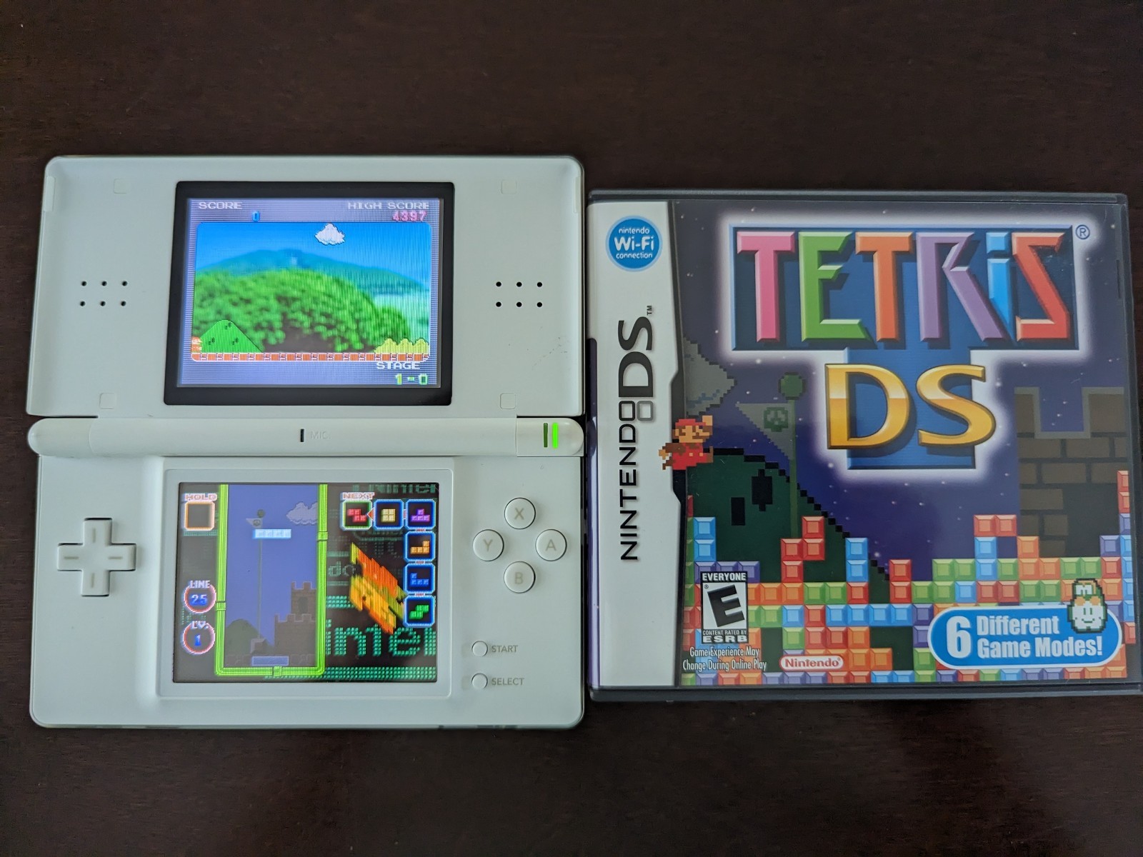 Nintendo DS Lite with Charger, Hard Case, soft case, 15 games in cases.