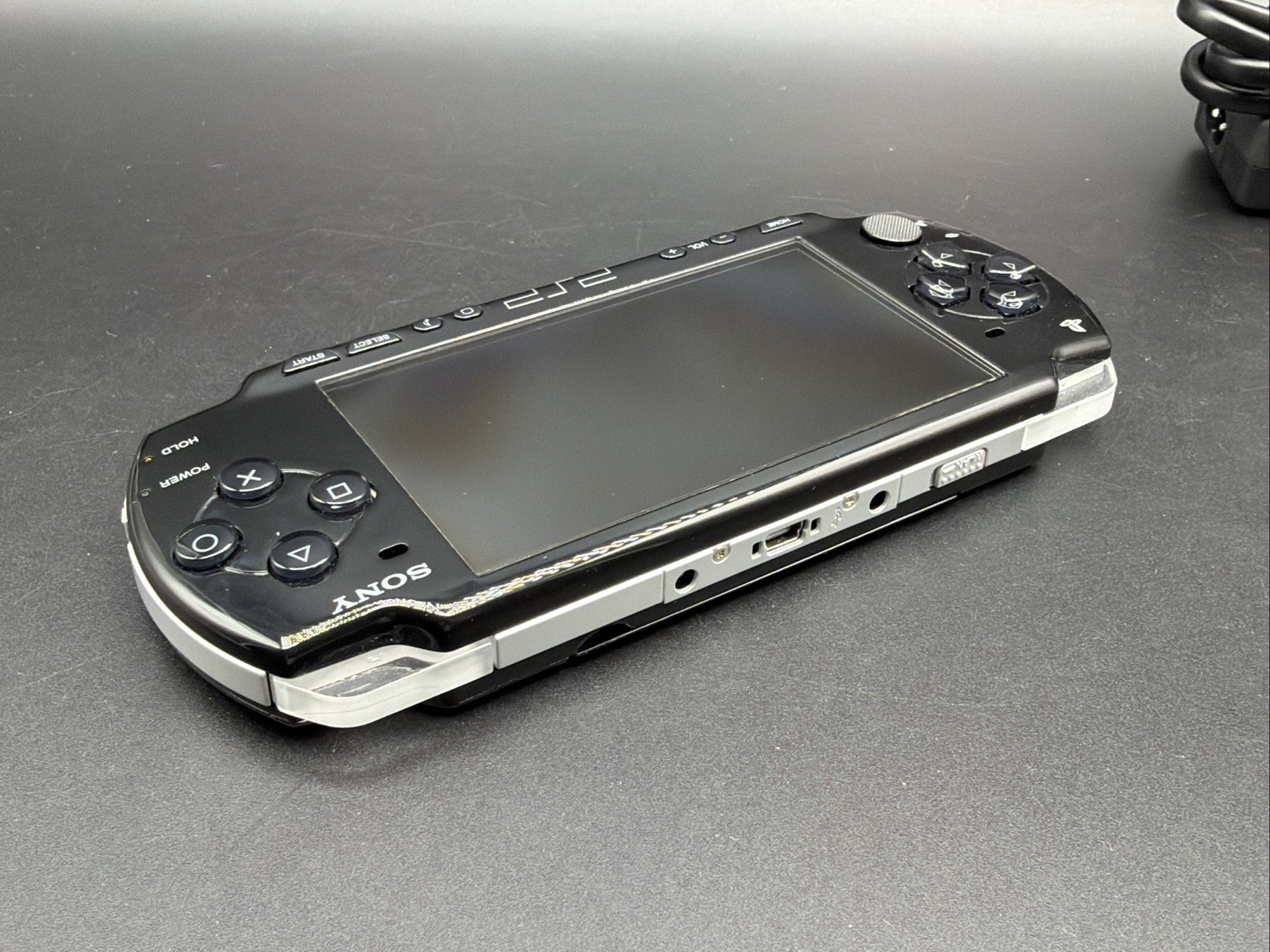 PSP 2001 Console W/Memory Stick 2GB AND CHARGER Working/ tested. W/ Loco Roco
