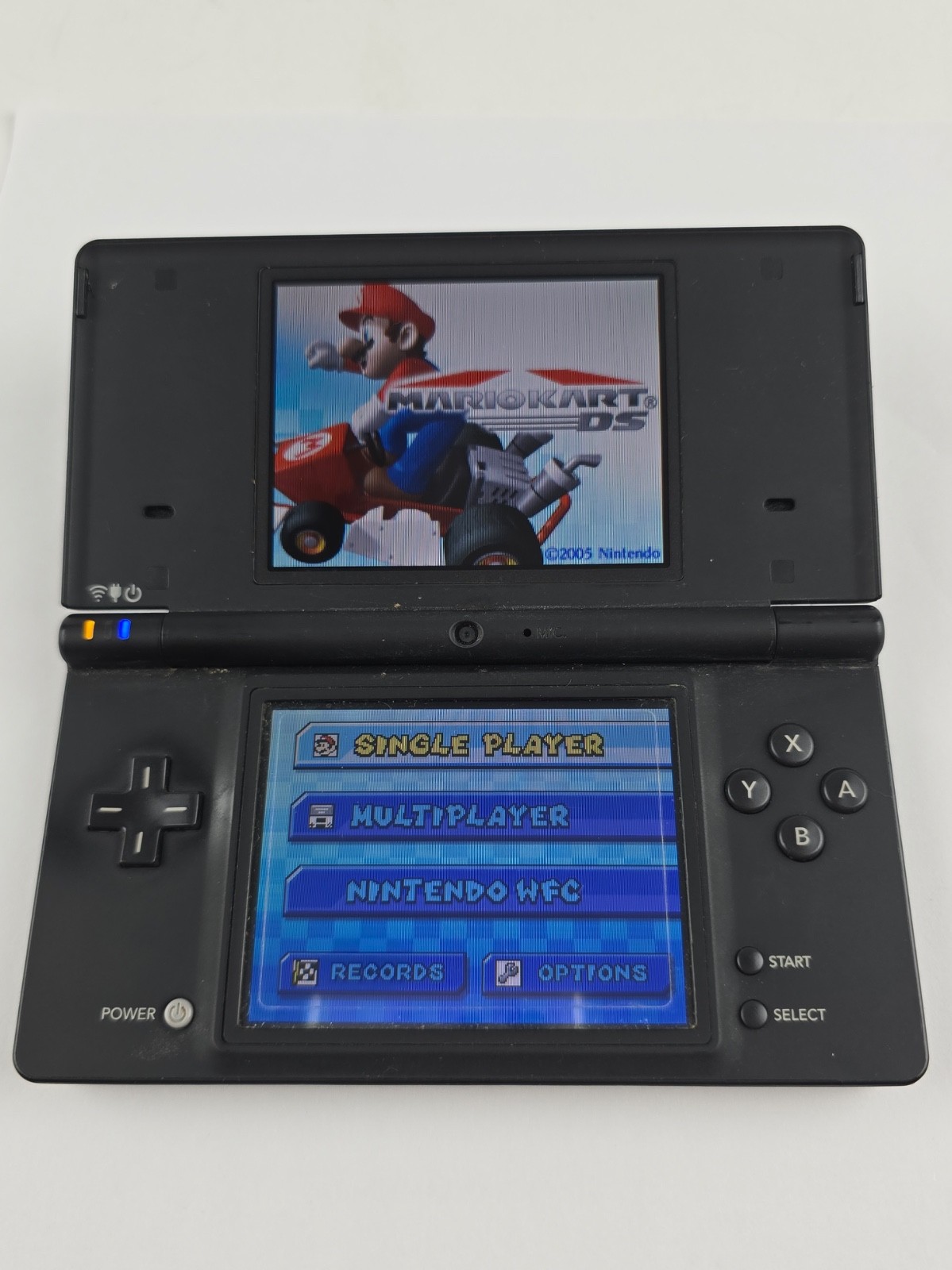 Nintendo DSi TWL-001 Black handheld system w/ Mario Kart -needs charger