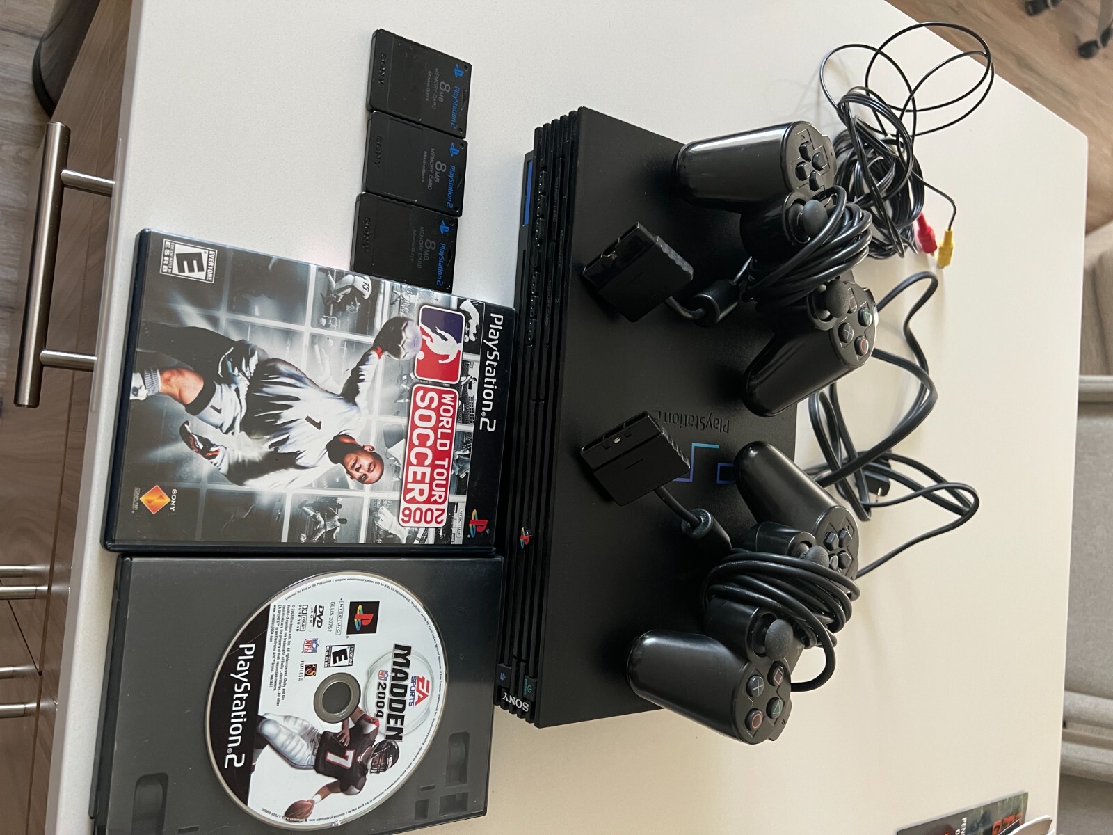 PlayStation 2 console bundle (2 controllers, 2 games, & 3 8mb memory cards)