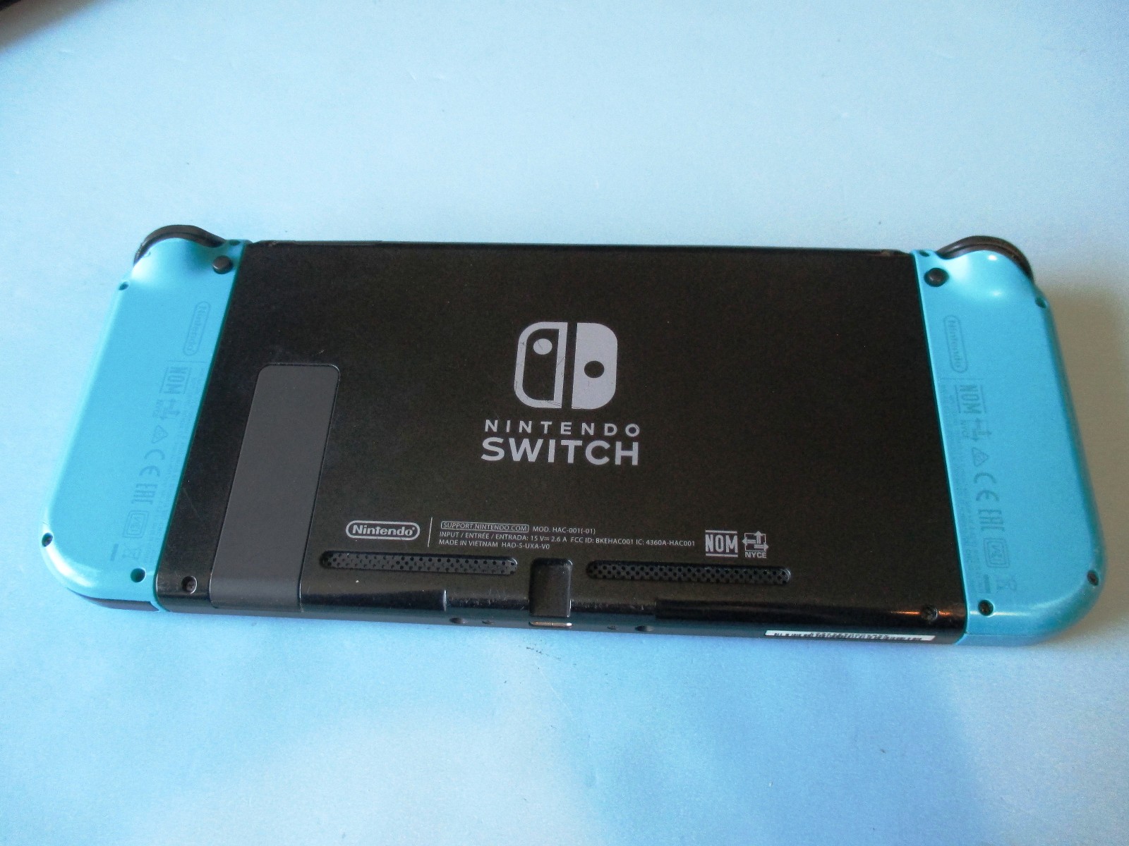 Nintendo Switch System Console w/Neon Blue Joy-Cons + Case & Charger