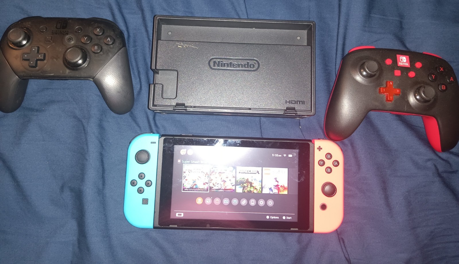 Nintendo Switch console with dock and two controllers