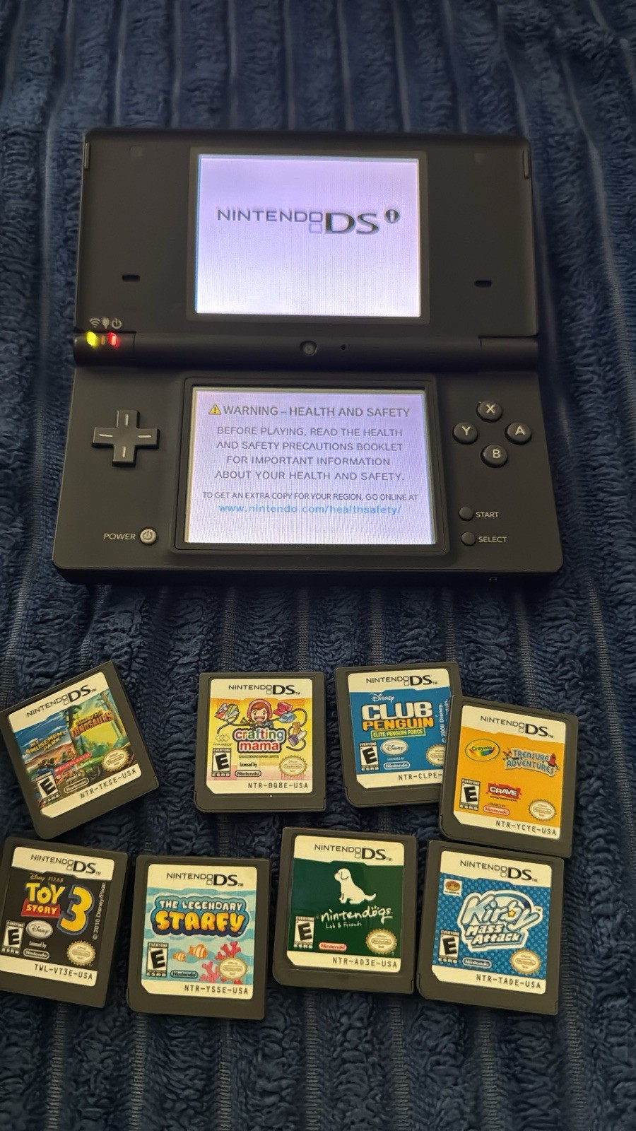 Nintendo DSi Launch Edition Black Handheld System 256mb ( megabytes ) W/ 8 Games