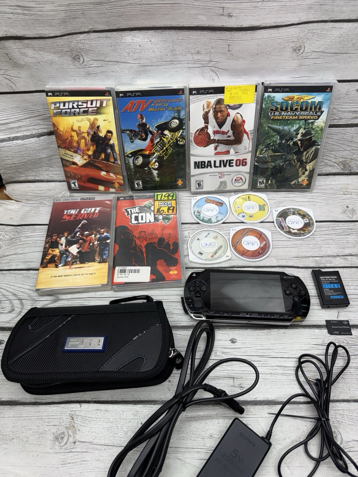 Sony PSP-1001 Black Console With Charger, 1GB Sony Storage Memory Card, 5 Games