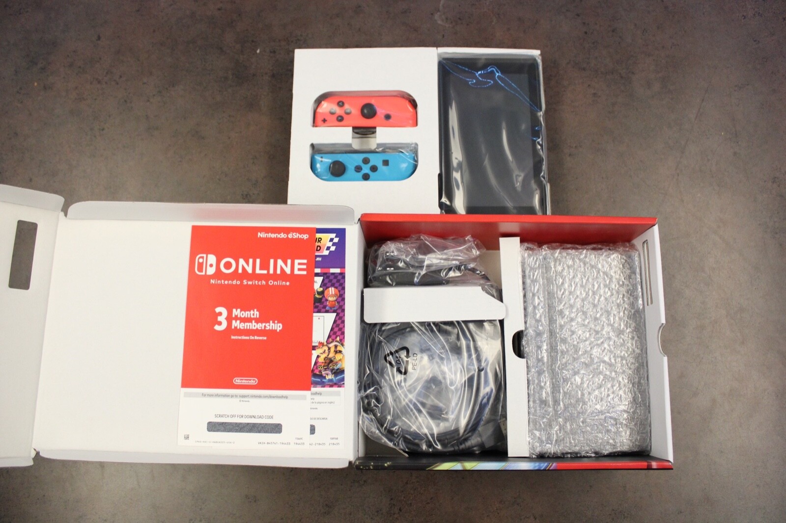 Nintendo Switch with Blue and Red Joy-Con Controllers and Mario Kart 8 Bundle 