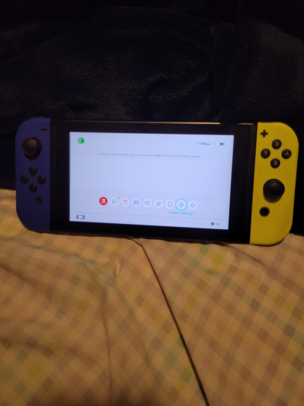 Used Nintendo Handheld Switch Console – Black with Blue and Yellow Joycons