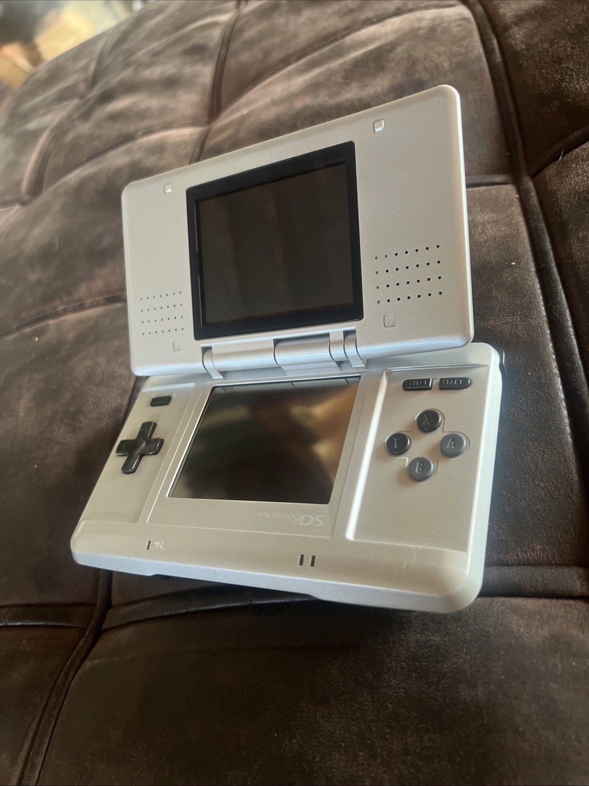 Titanium silver Original Nintendo DS with charger and stylus