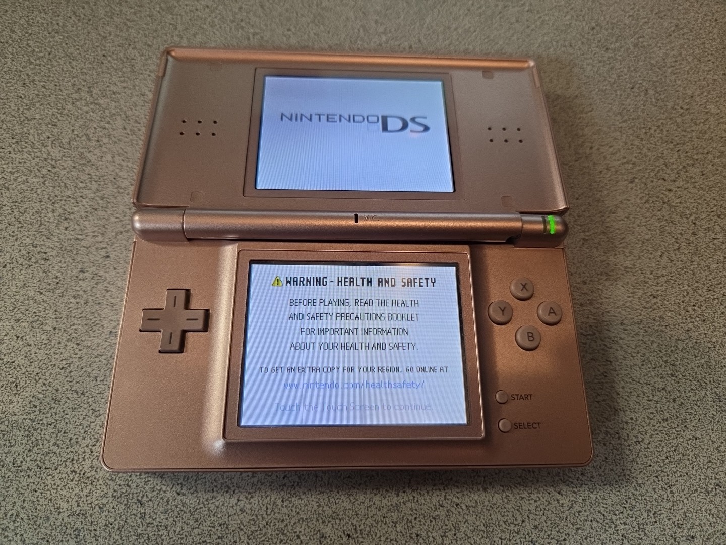 Nintendo DS Lite (Metallic Rose) w/charger, Works but some damage, PLEASE READ!!