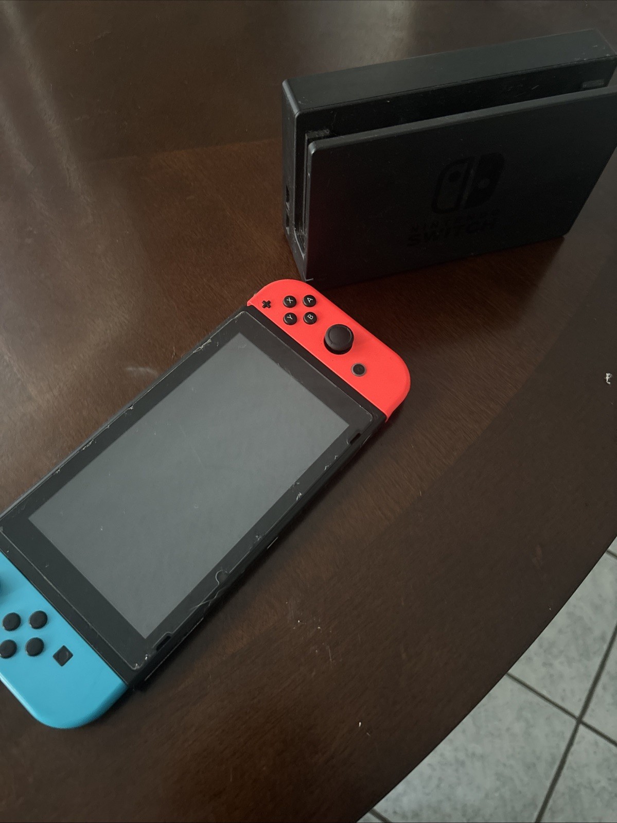 The system is low quality/used condition Charger is not included