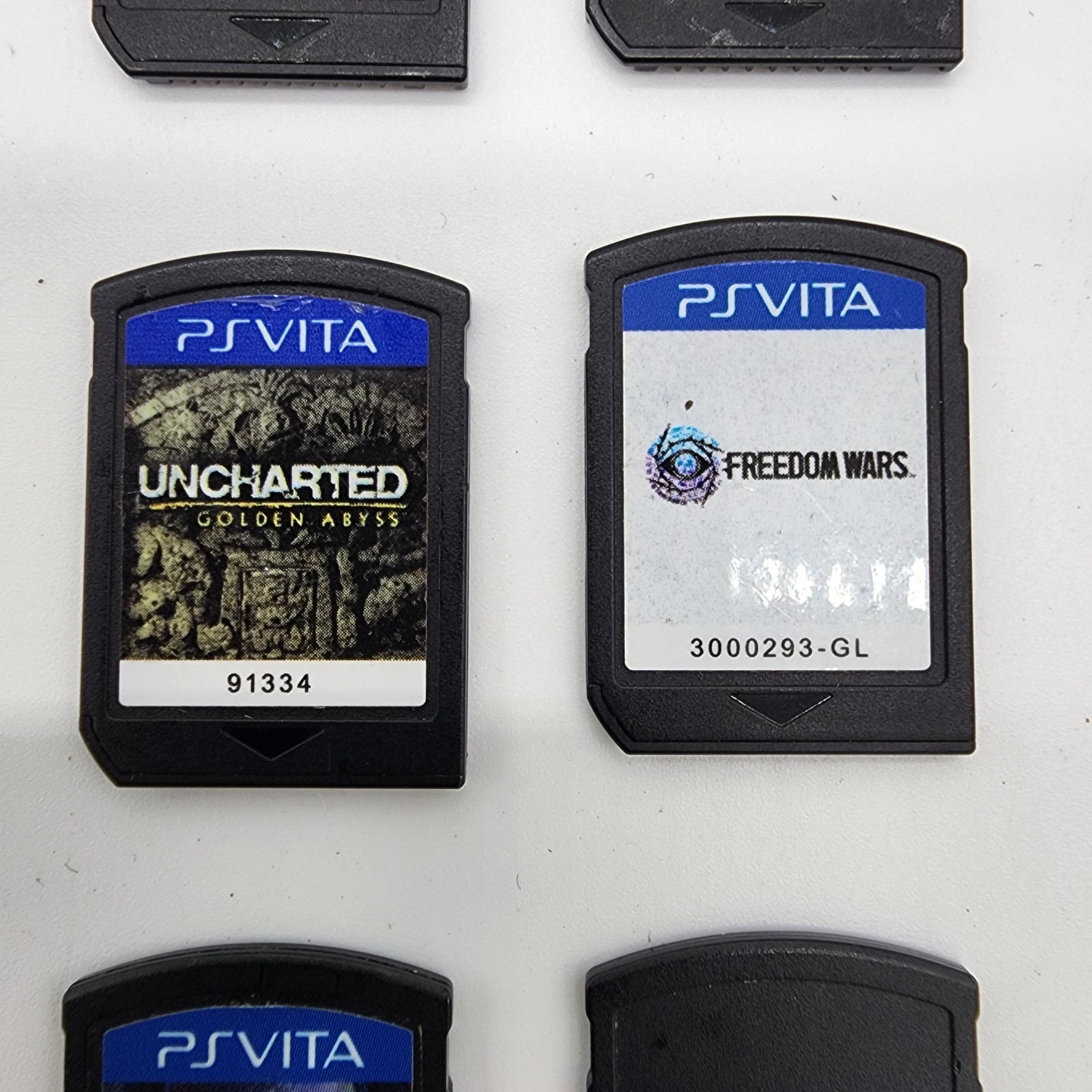 PlayStation PS Vita PCH-1001 Bundle – 5 Games, Memory Card, 8 GB Charger