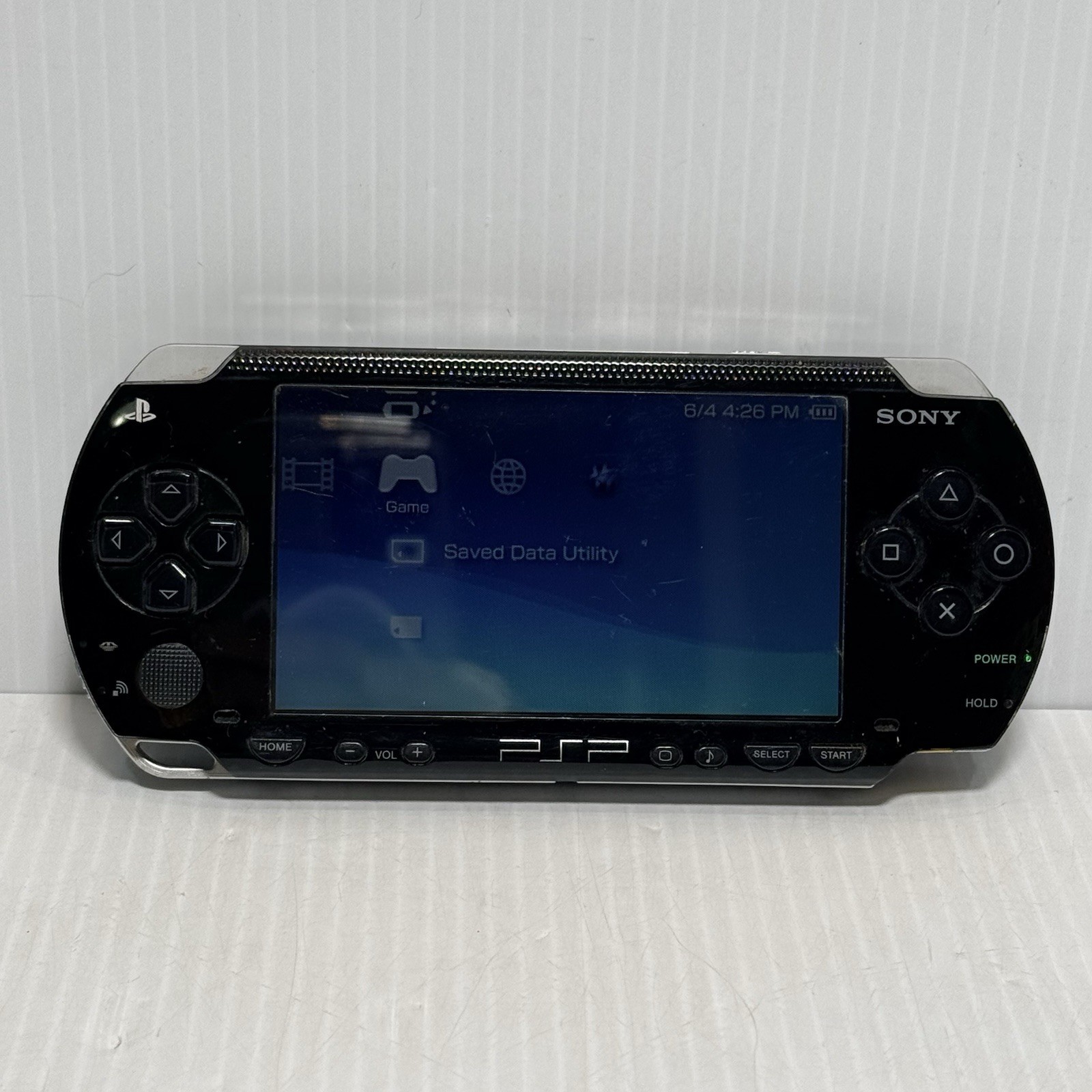 Sony PSP-1001 Black Console With Charger And 32 MB Sony Storage Memory Card