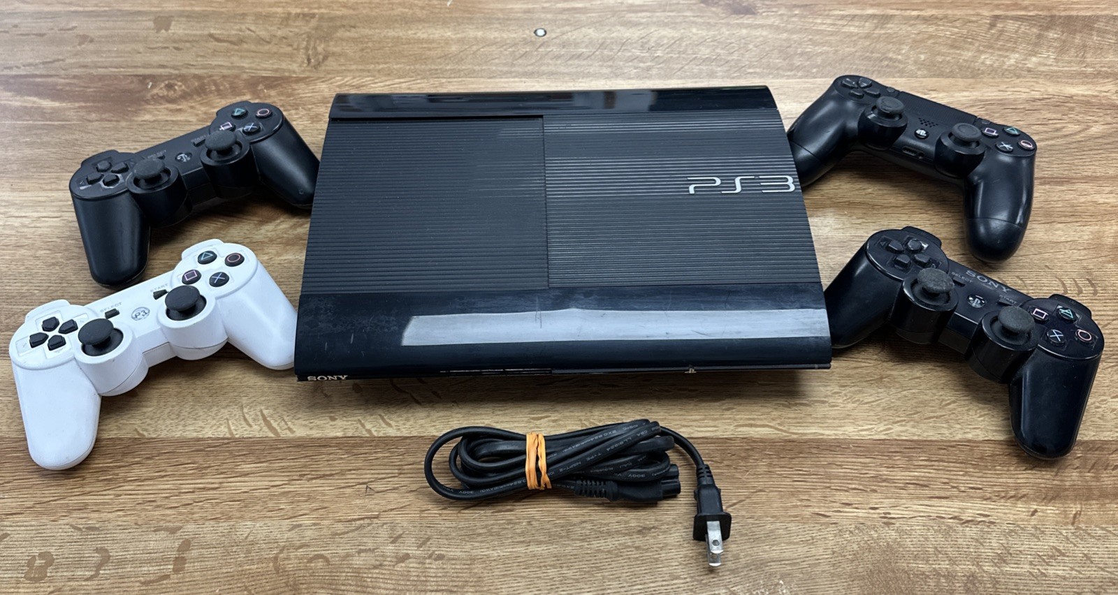 PlayStation 3 250GB W/ 4 Controllers *WORKS BUT DOESNT READ DISKS*& power supply