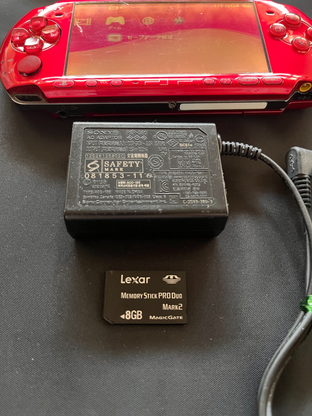 SONY PSP-3000 Radiant Red + AC charger + 8GB Memory – Working, Rank B