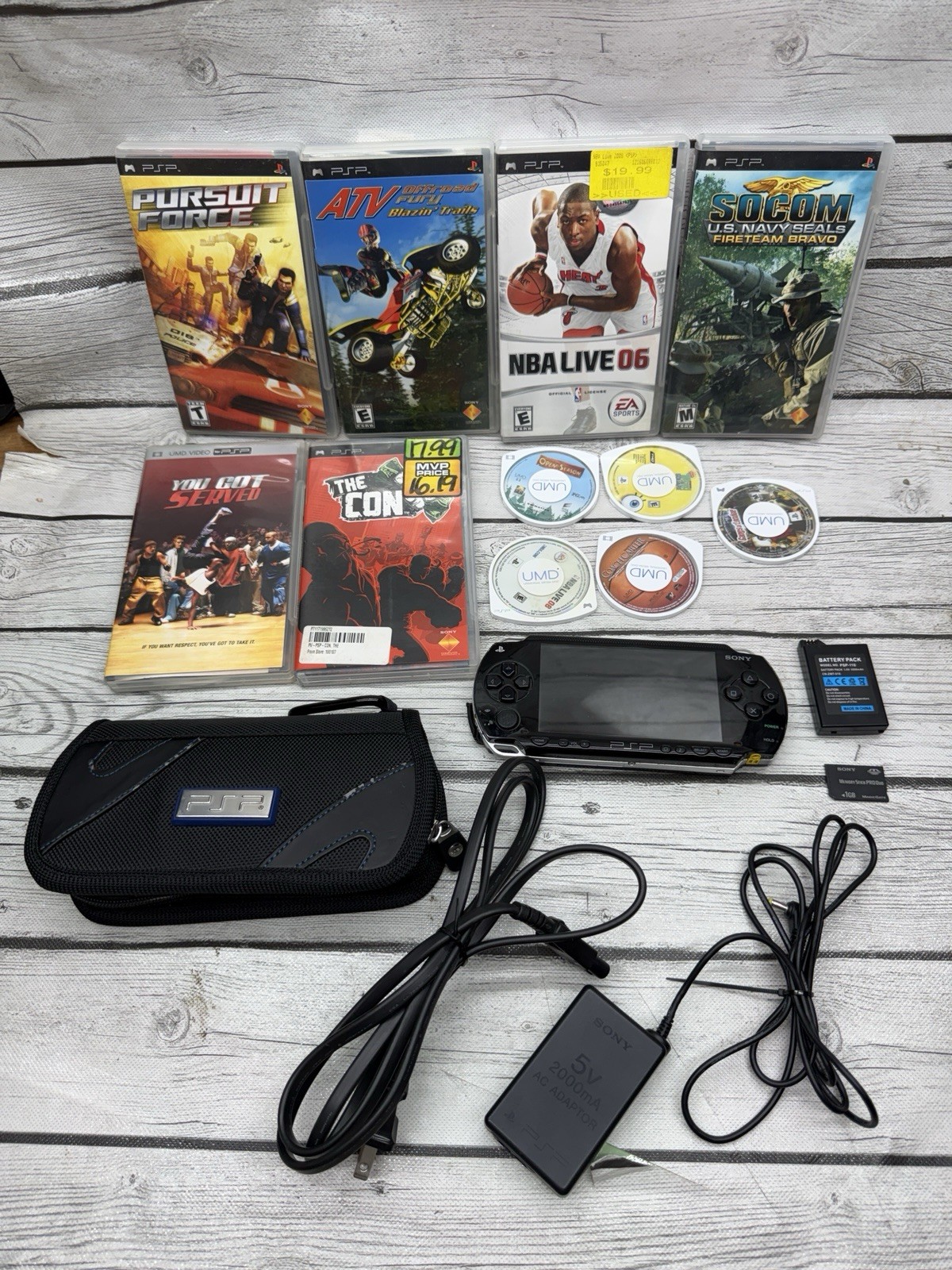 Sony PSP-1001 Black Console With Charger, 1GB Sony Storage Memory Card, 5 Games