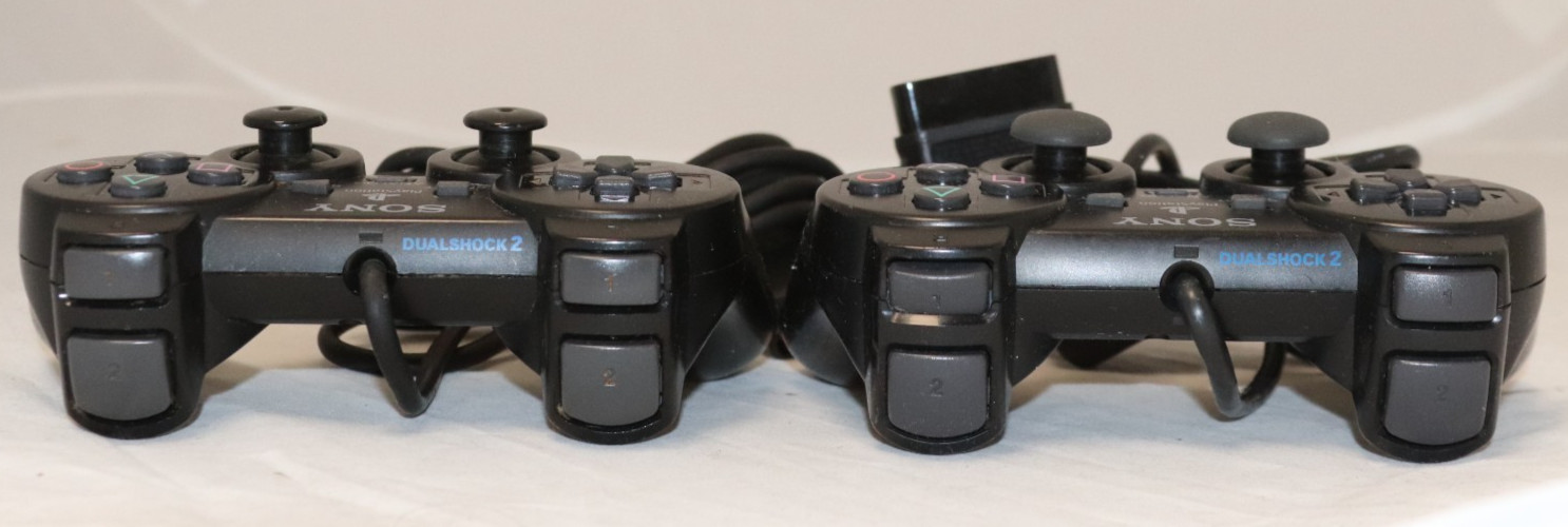 Sony PlayStation 2 Slim (SCPH-75001) W/ two controllers