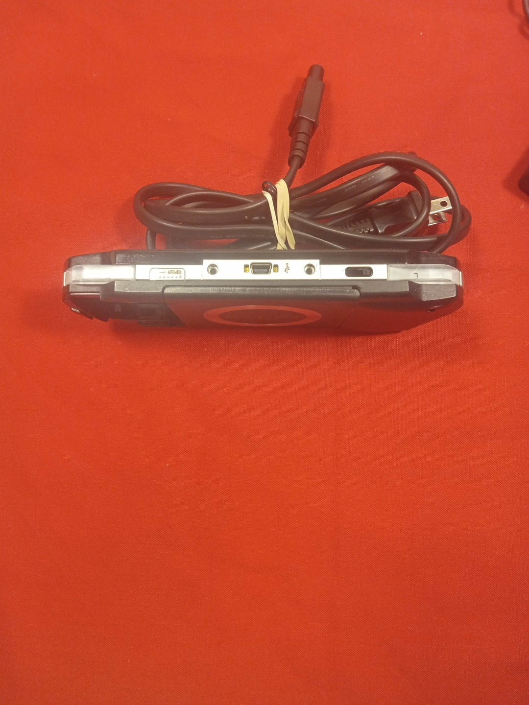 PSP 1001 CONSOLE+AC ADAPTER/NO TOGGLE BUTTON OR BATTERY & COVER/ SEE…