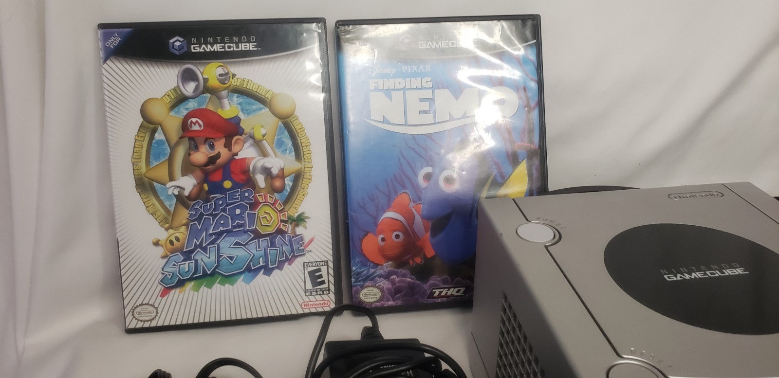 GameCube with 3 remotes, 2 games, cords, and remotes!