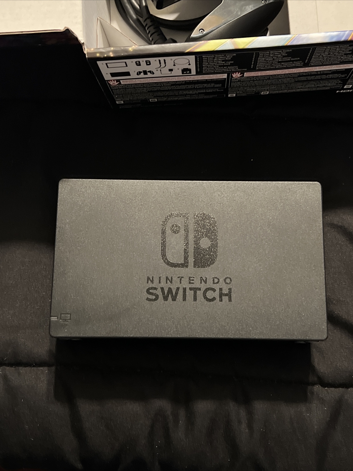 Nintendo Switch Blue and Red Joy-Con Controllers and Mario Kart 8