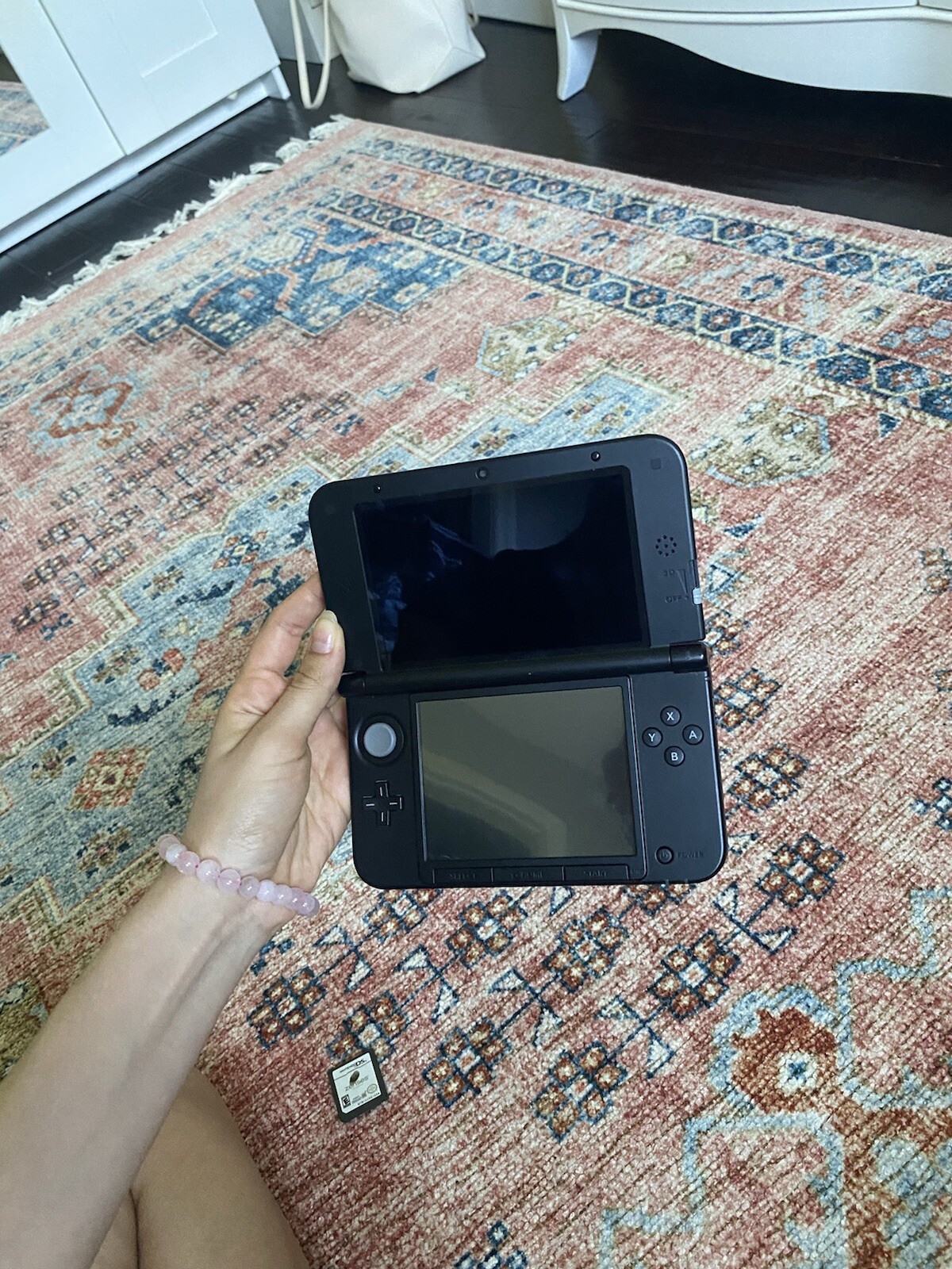Red Nintendo 3DS XL with 3 games, charger not included