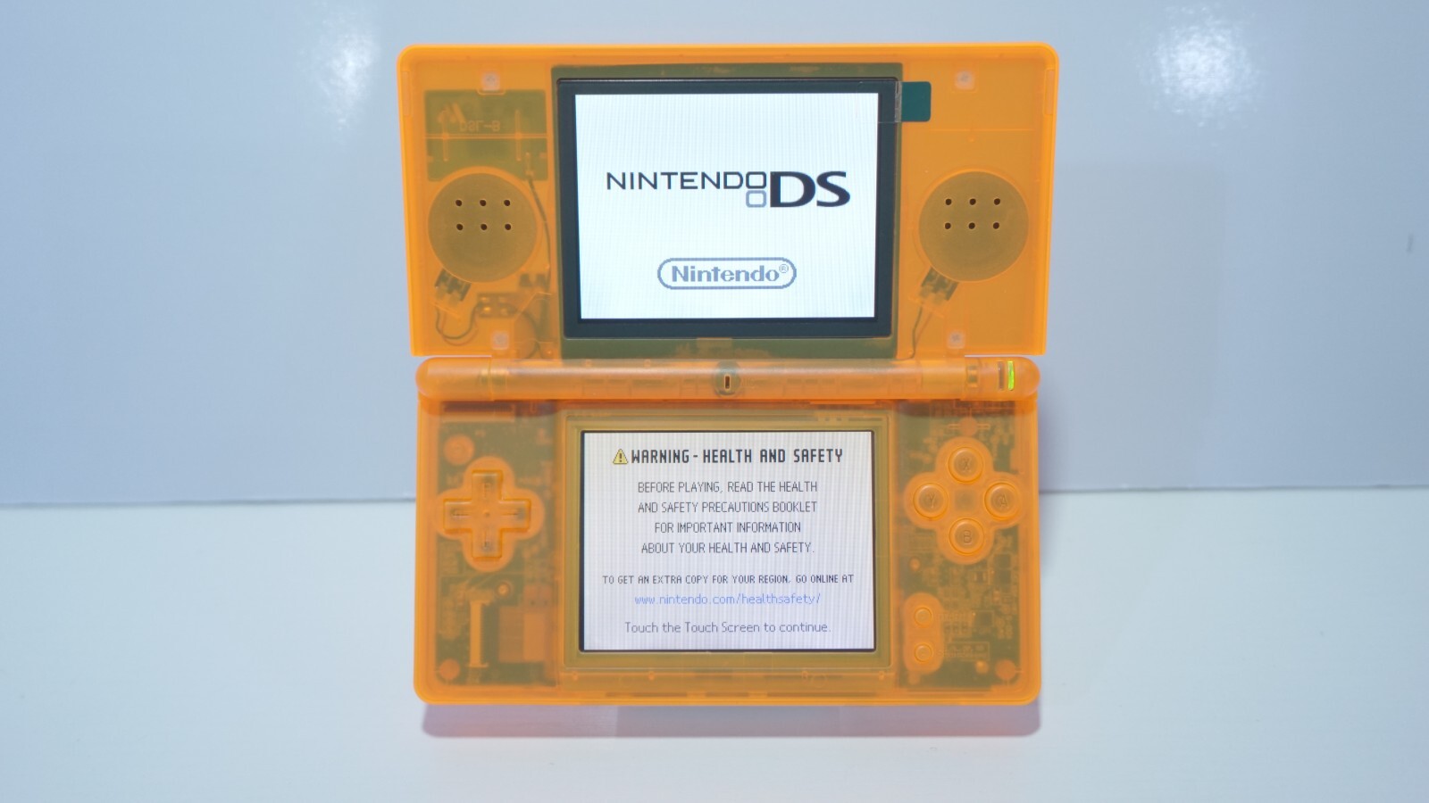 Nintendo DS Lite Transparent Clear Orange Handheld System with Charger & Stylus