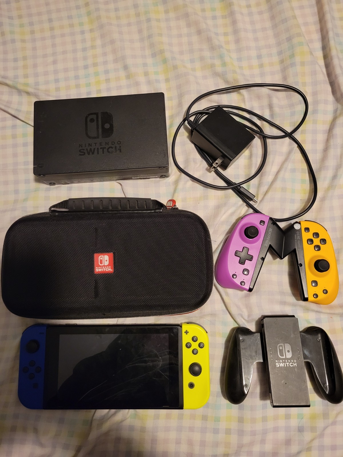 Used Nintendo Handheld Switch Console – Black with Blue and Yellow Joycons