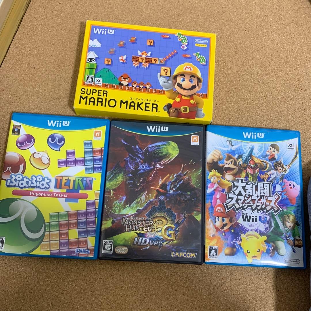 Three Nintendo WiiU Pro controllers and four games