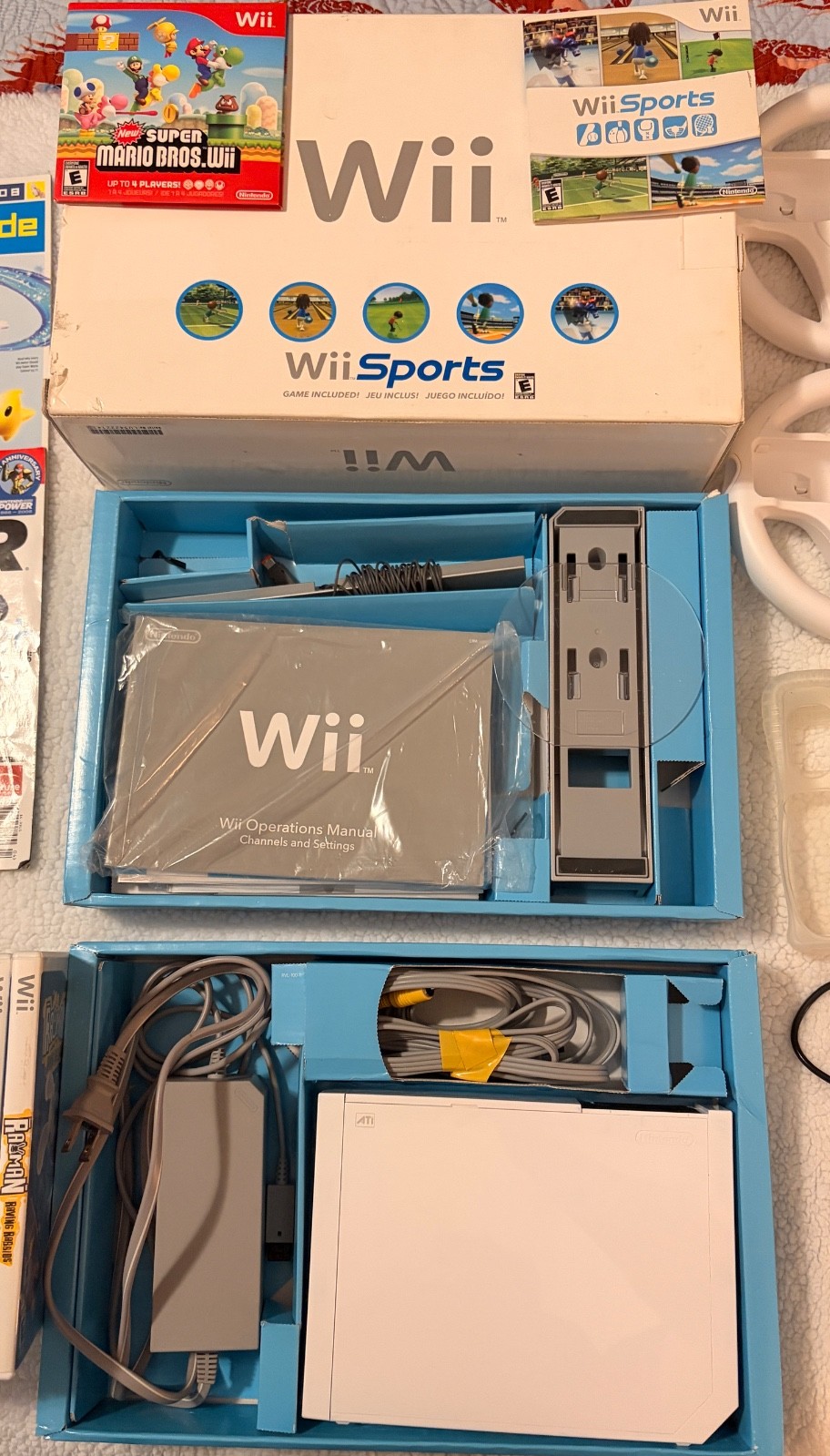 Nintendo wii with box and instructions, 15 games, rabbids charger plus more