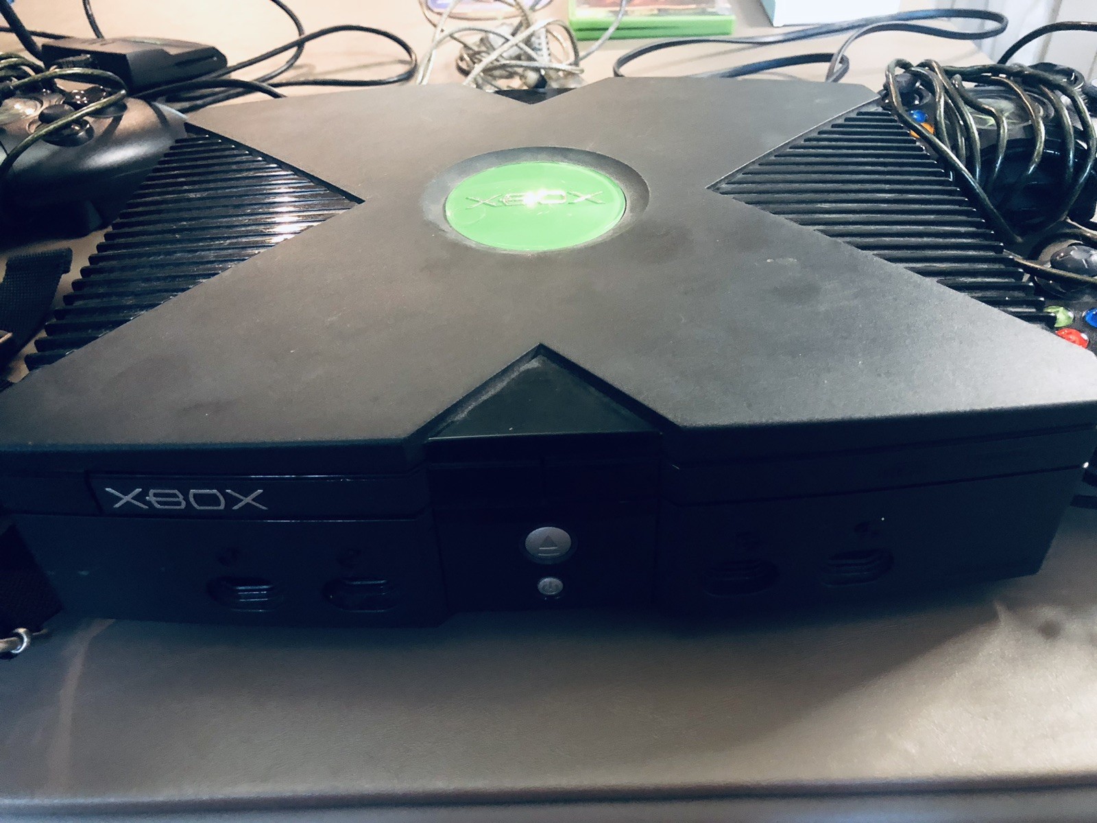 Xbox console, three controllers, carryting case, 2 games, and more