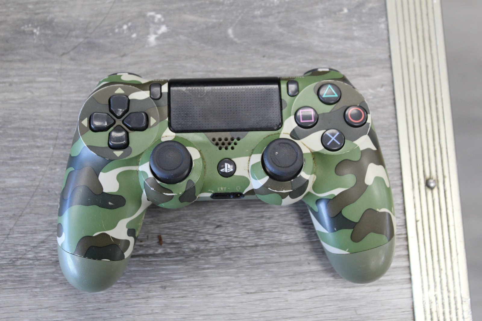 Sony PlayStation 4 Pro 1TB Game Console – Jet Black with Camo Controller
