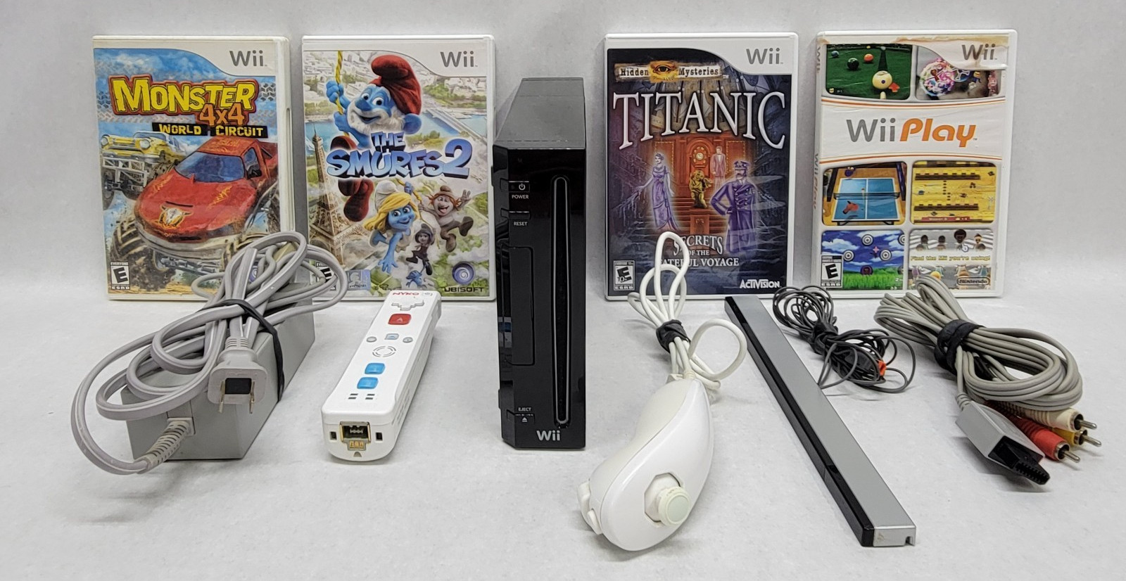 Nintendo Wii Bundle w/ Cords, Controllers & 4 Games (Play, Smurfs, 4×4, Titanic)