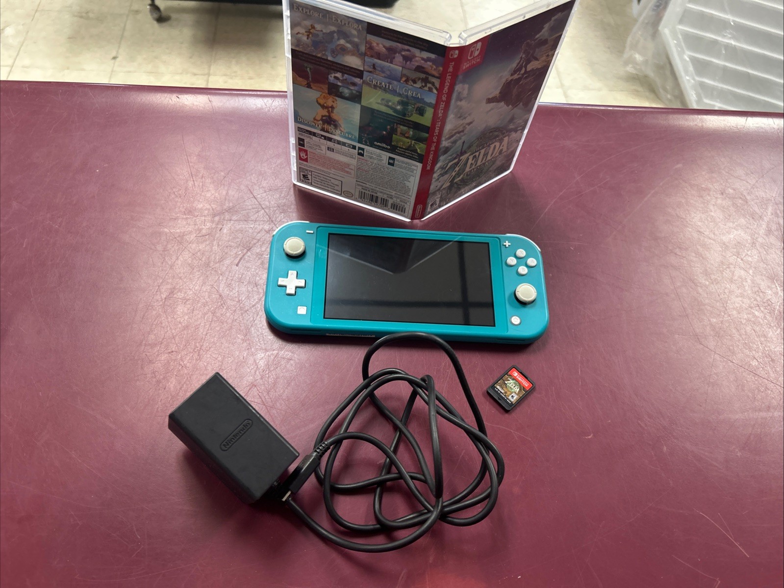 Nintendo Switch Lite Turquoise Teal Handheld Console Bundle with Zelda Game