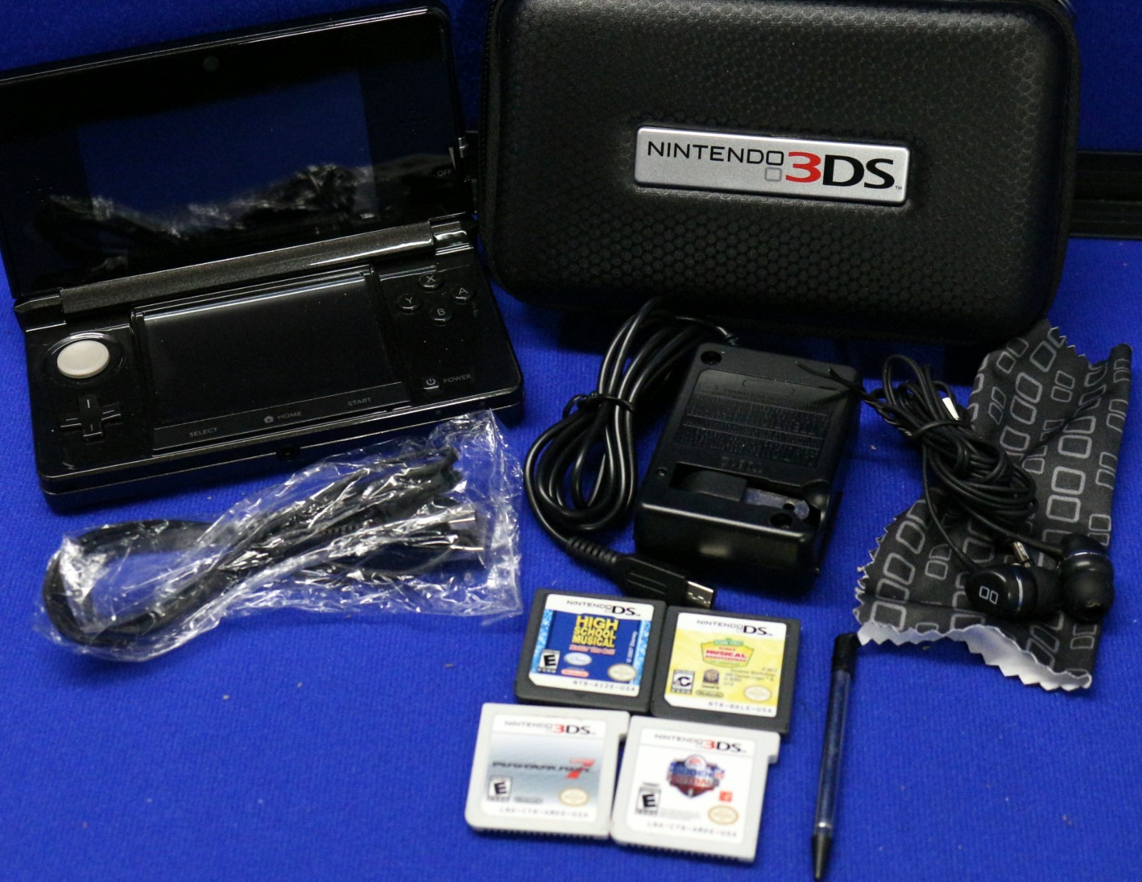 Nintendo 3DS Cosmo Black Console Case, Earbuds, 1 stylus, Charger + 4 Games