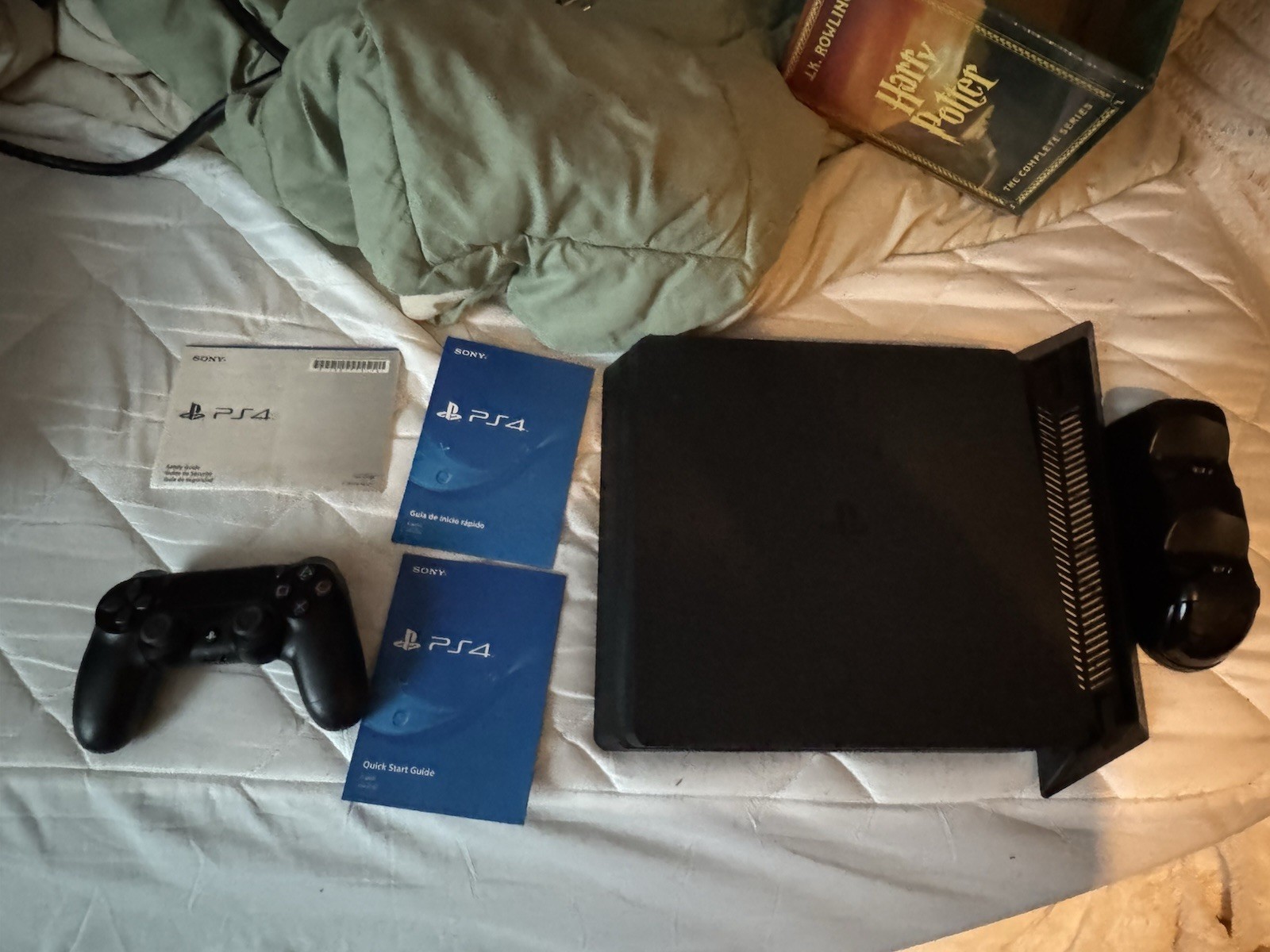 PlayStation 4 Slim with 1TB HDD, 1 controller, cables, and extra stuff