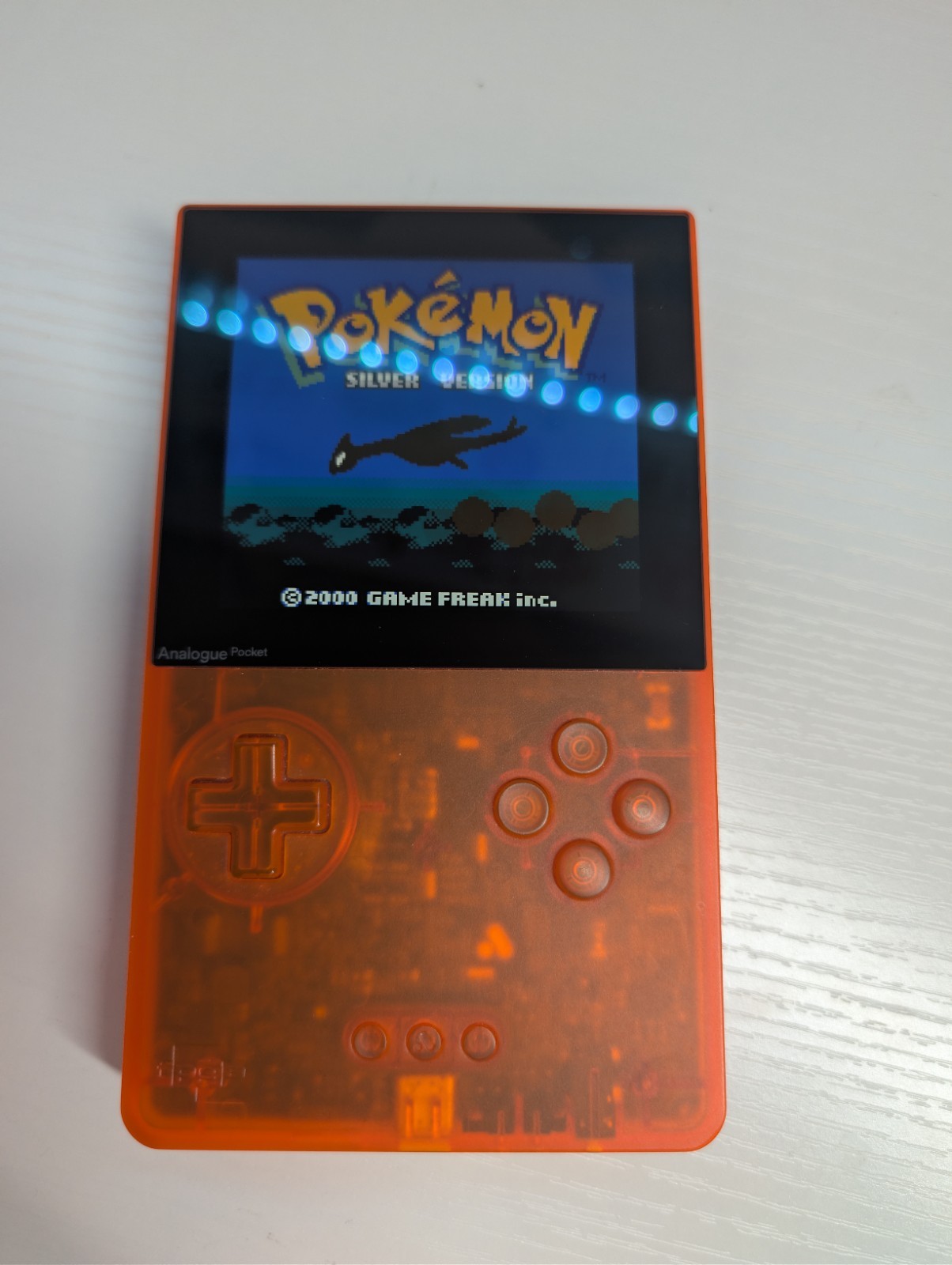 Analogue Pocket Handheld – Transparent Orange Limited Edition w/ pokemon silver