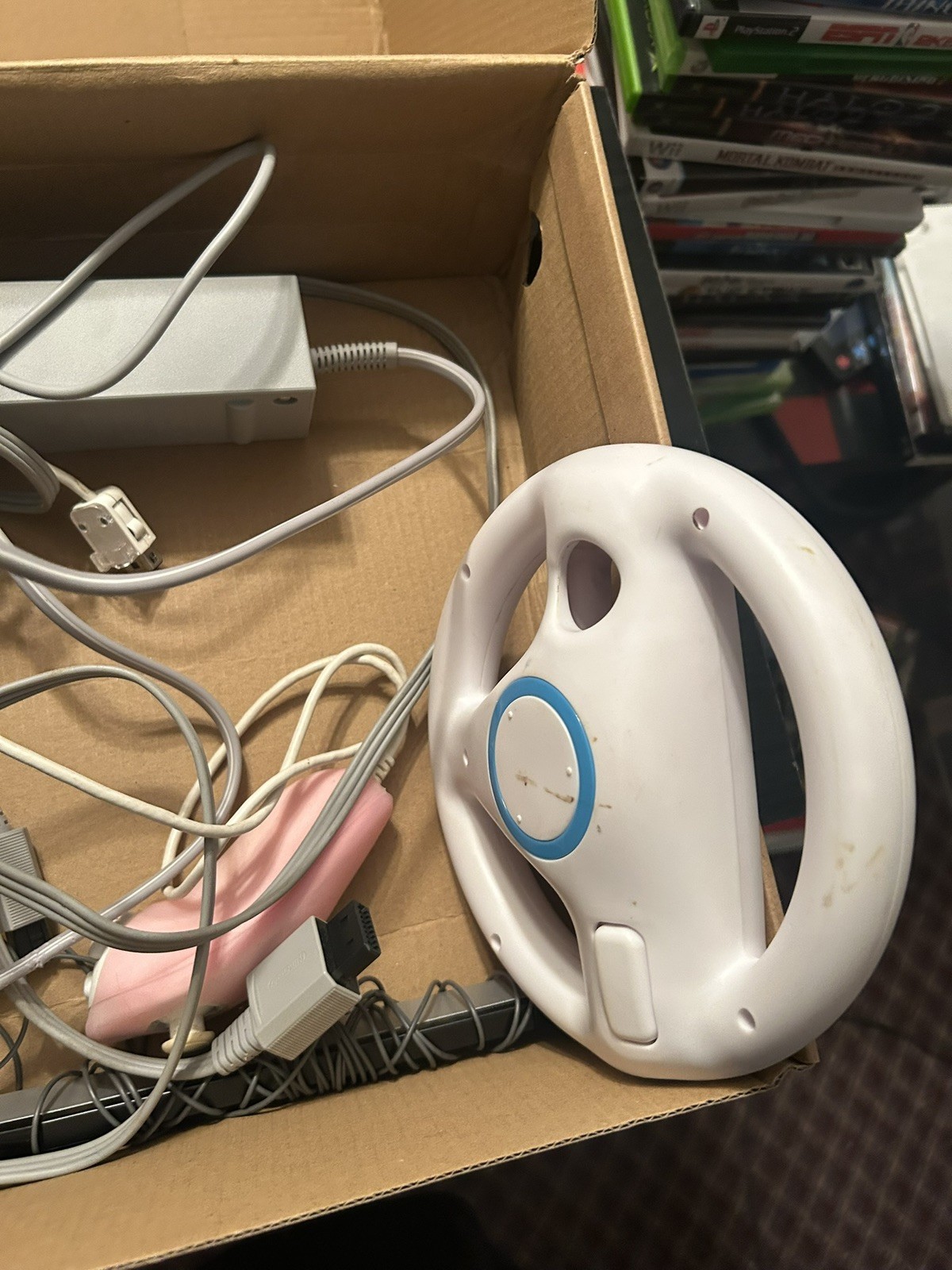 Nintendo Wii Tested And Working. Includes cables and everything pictured.