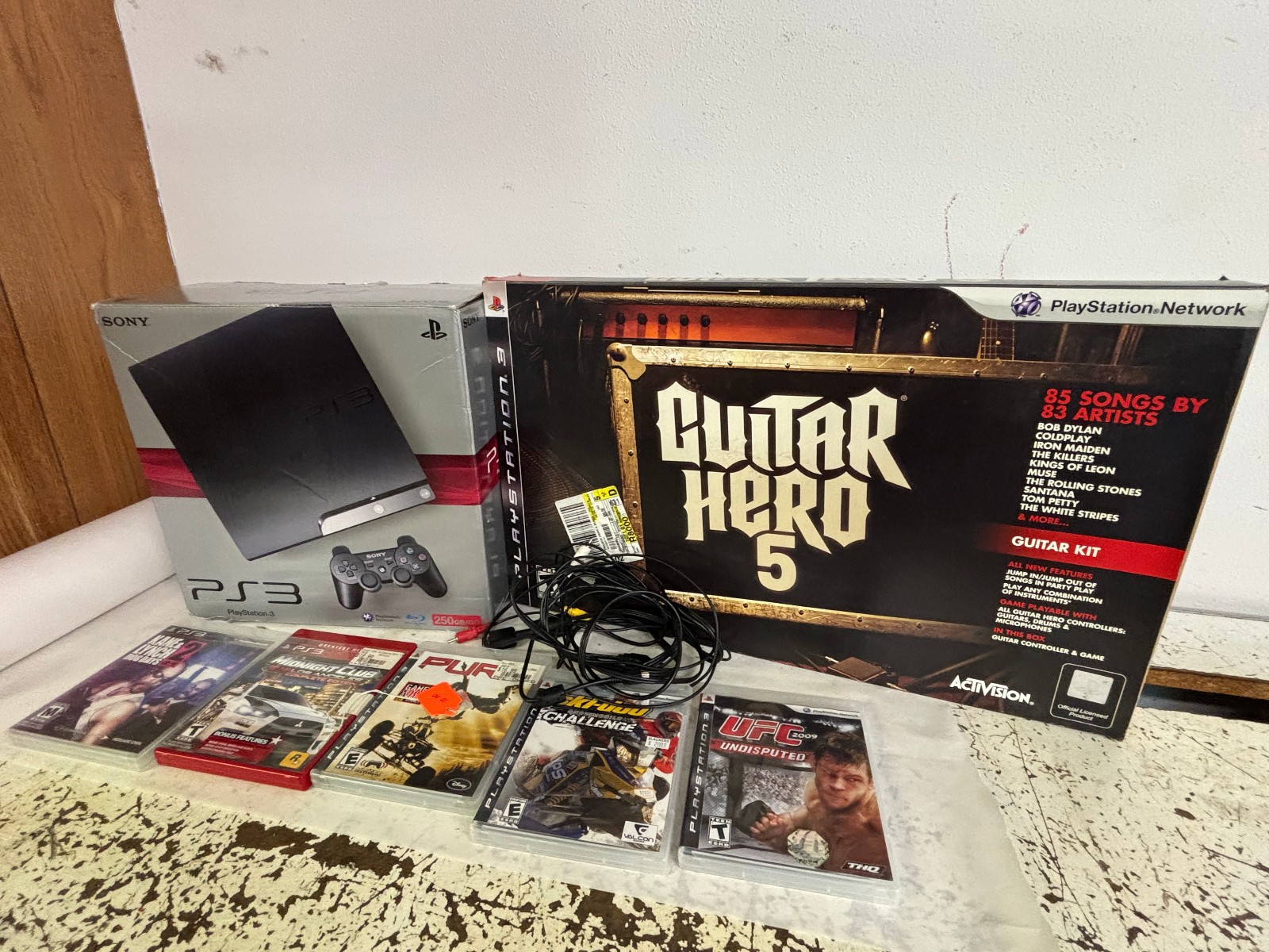 Sony PlayStation 3 – Slim 250GB Console – Charcoal Black & Guitar Hero & Games