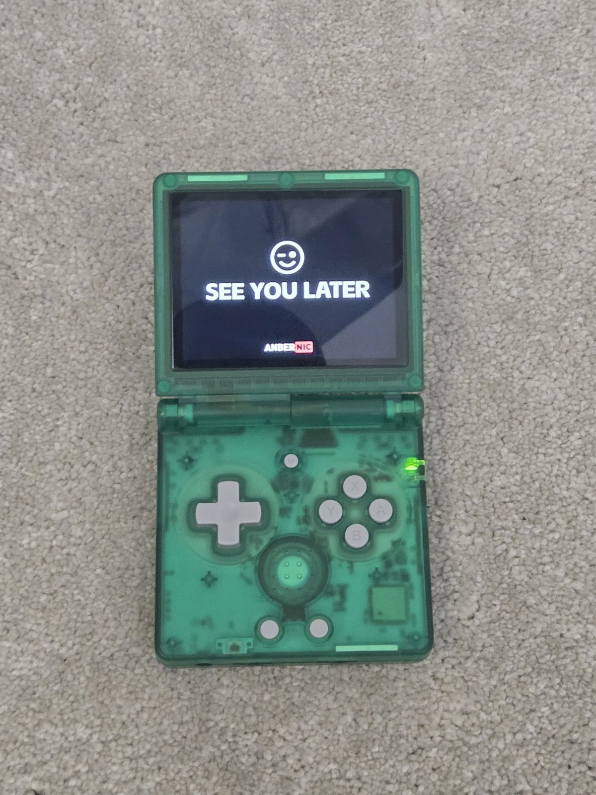 Anbernic game console RG35XXSP retro handheld transparent green tested arcade