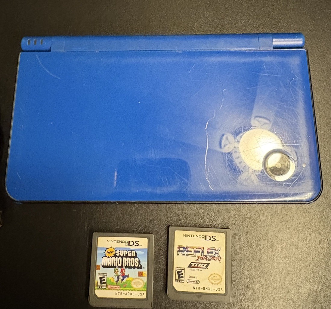 Nintendo DSi XL Midnight w/ USB charger, includes 2 Games, no stylus