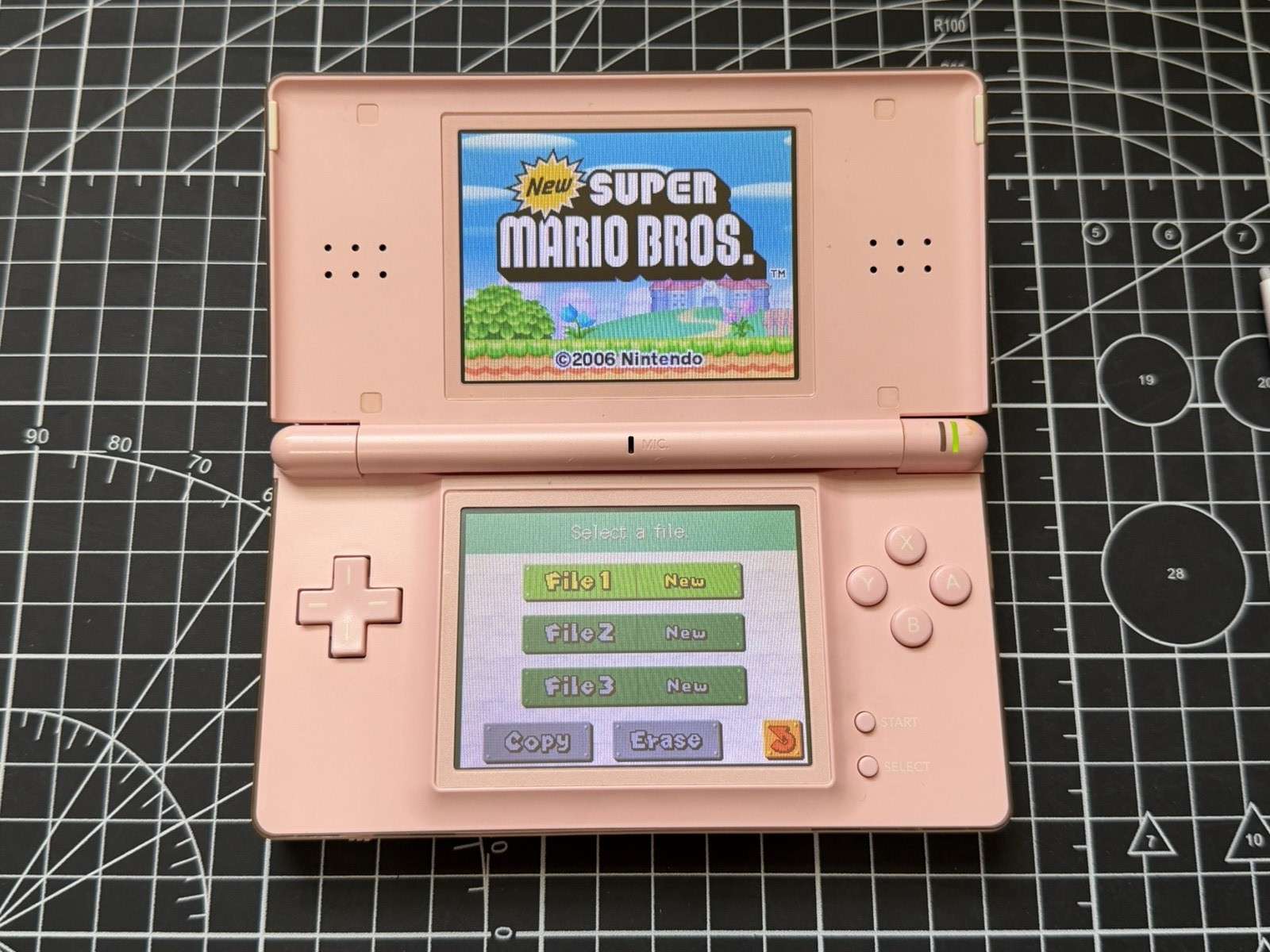 Nintendo DS Lite Used OEM Coral Pink W/ R4 & 2GB SD – 100% Tested Region Free