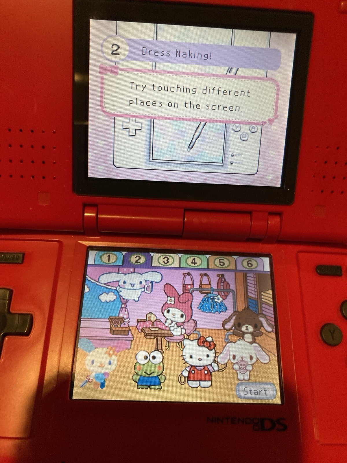 Nintendo DS Red Handheld Dual Screen Console with EVOLUTION MULTI-GAMES ON 2GB