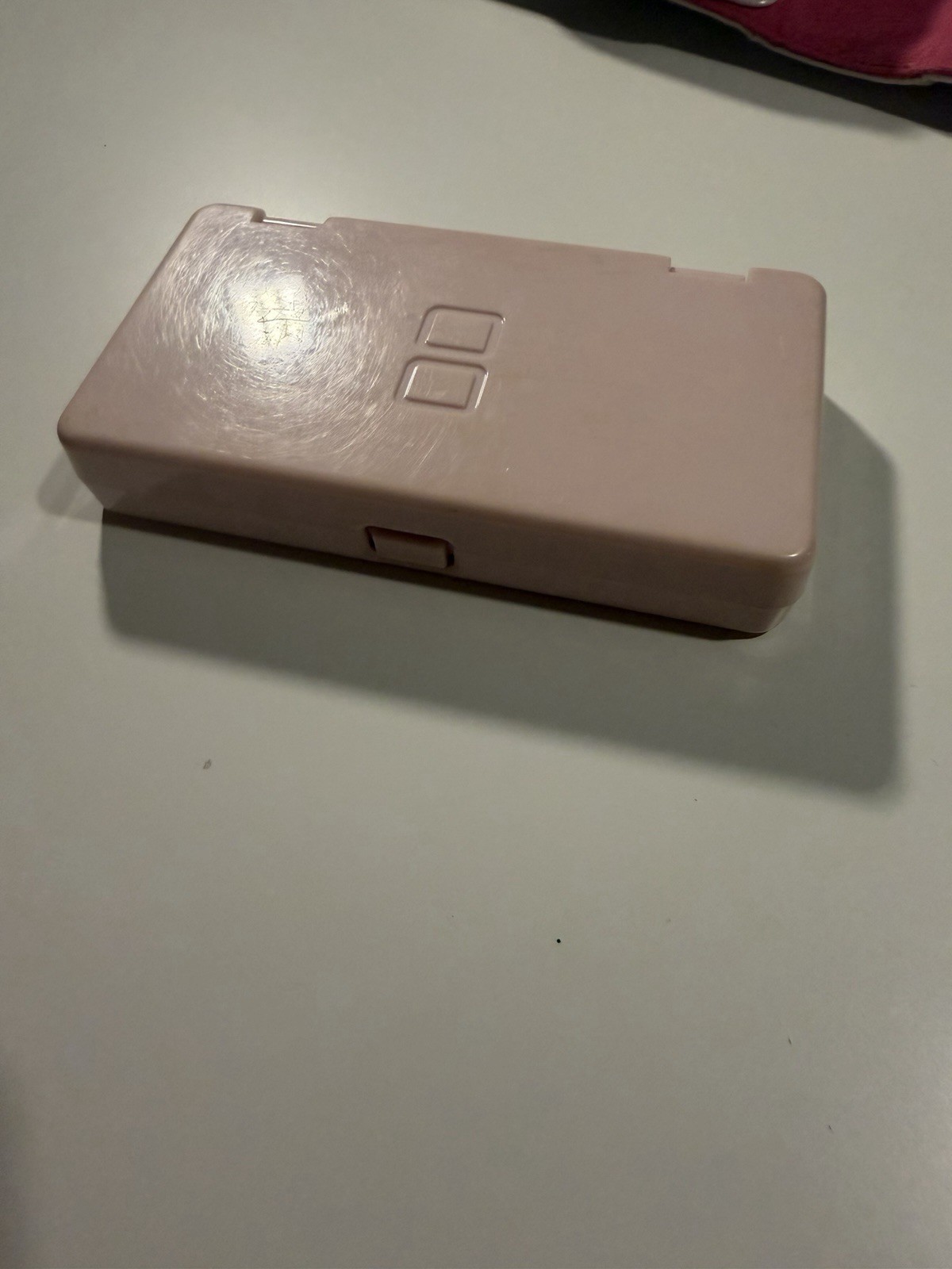Nintendo DS Lite Metallic Rose System With Charger, Original Box, And 2 Cases