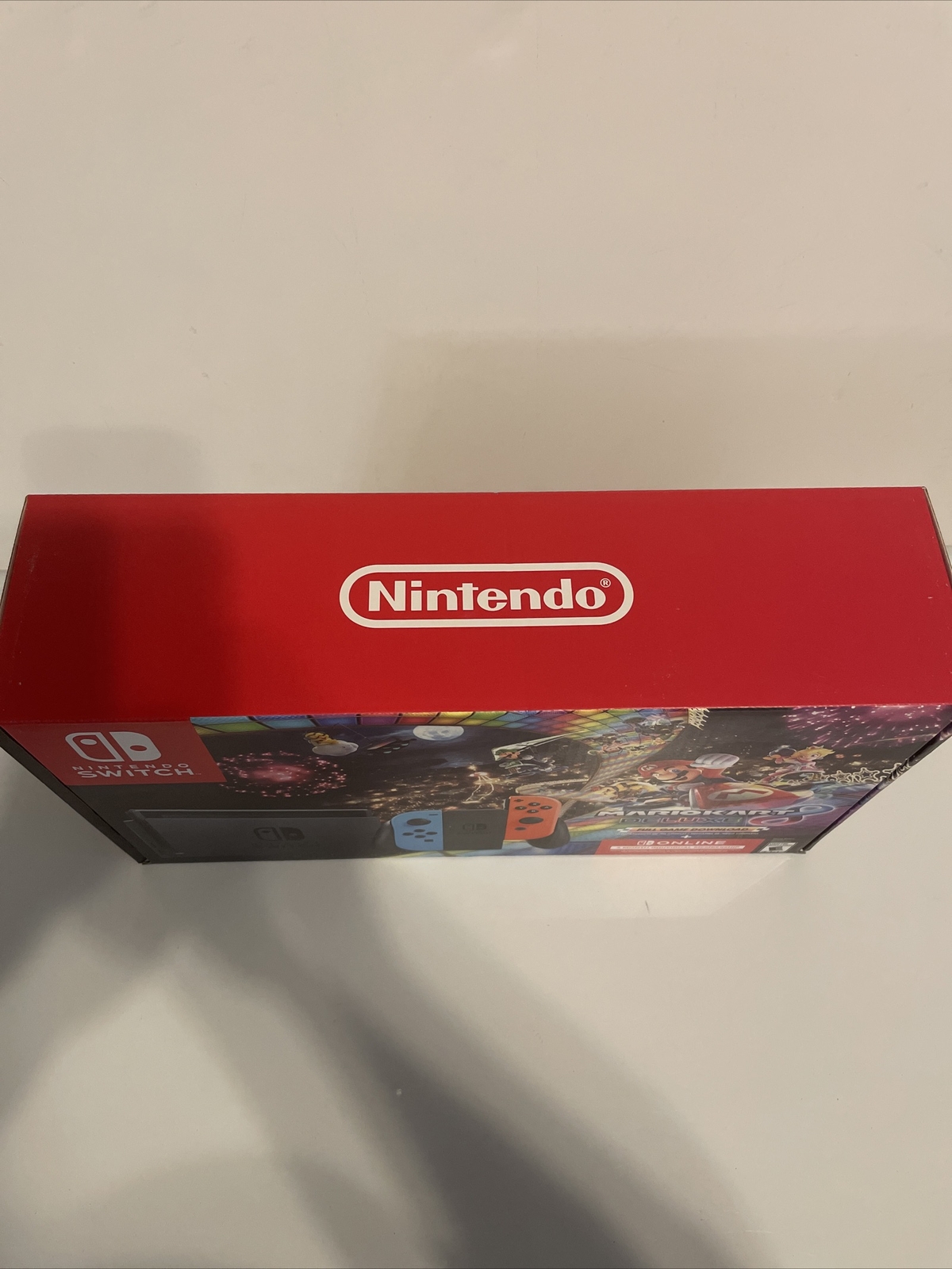 Nintendo Switch with Blue and Red Joy-Con Controllers and Mario Kart 8 Bundle