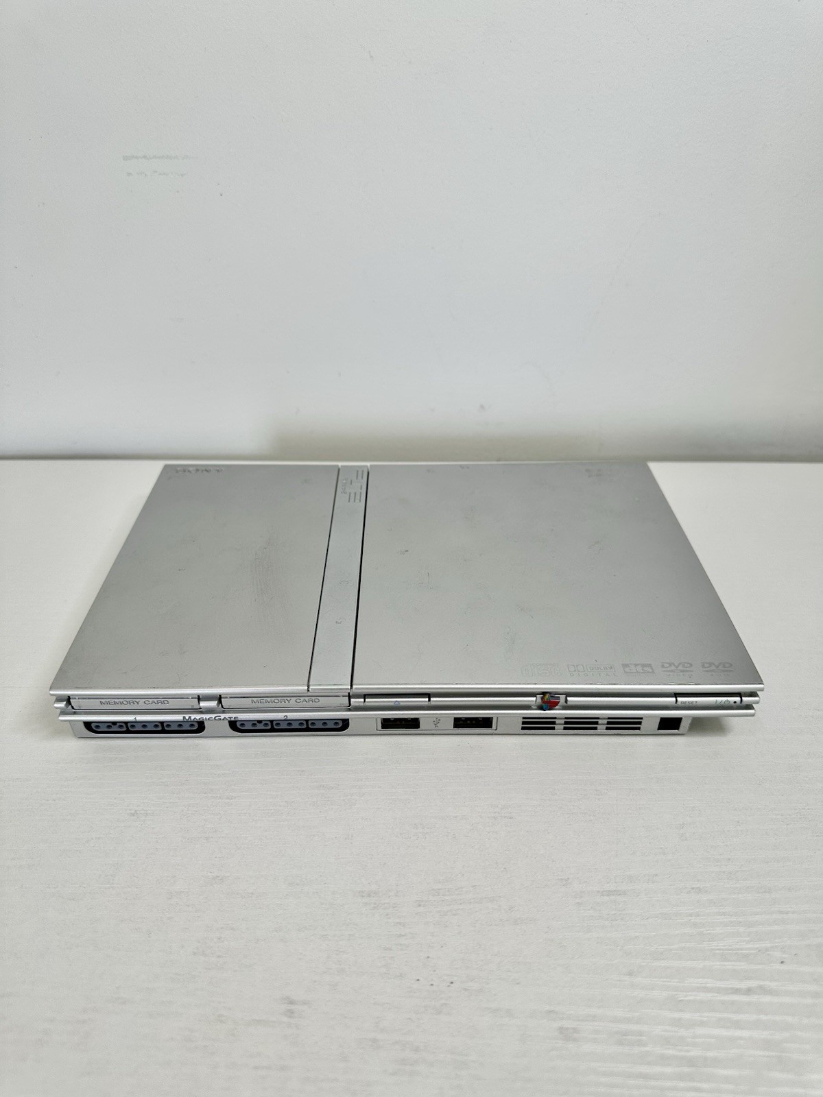 Silver PlayStation 2 Slim OEM Bundle – OEM Controller, OEM Cables, Memory Card